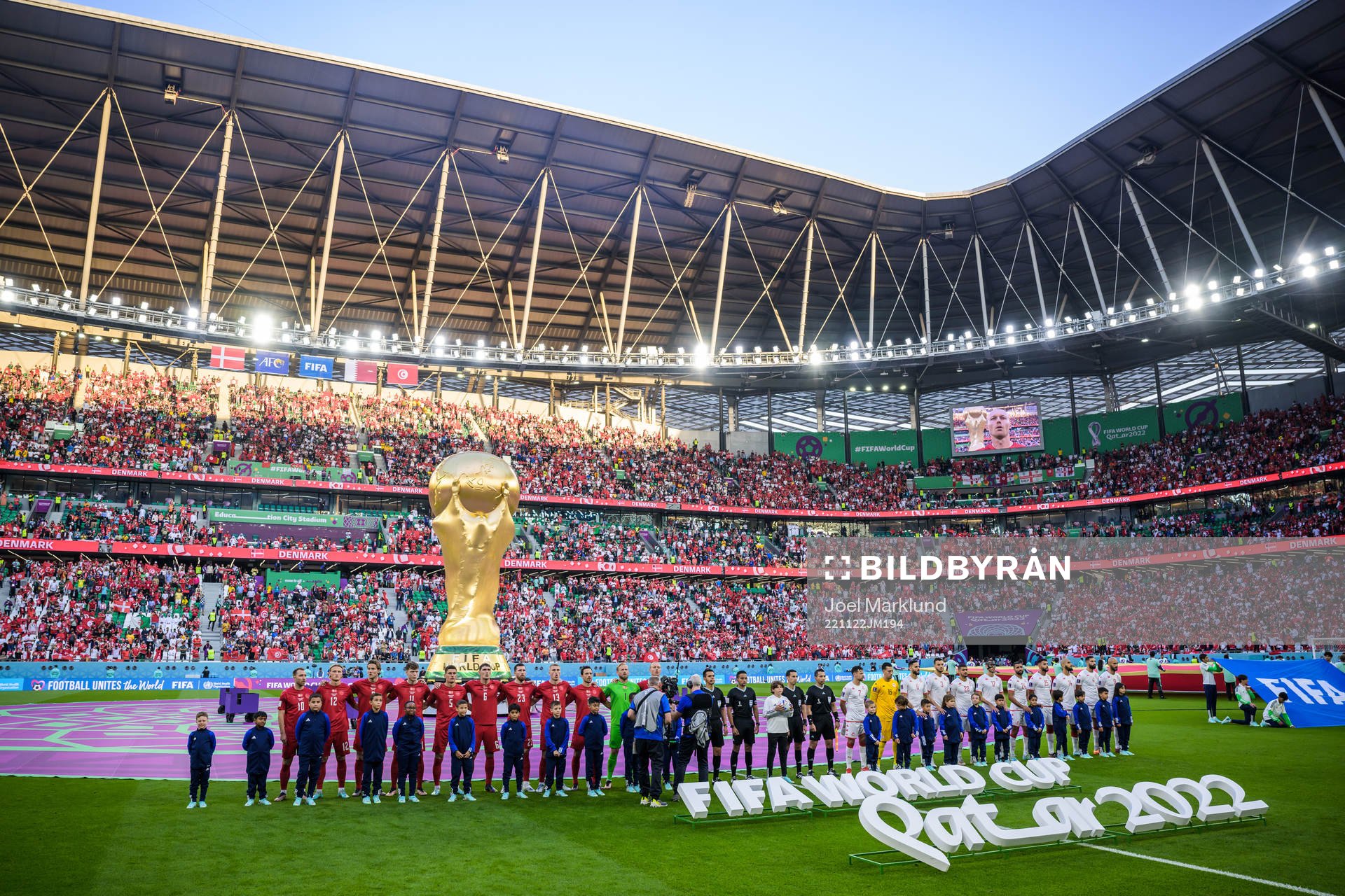 Players of Denmark and Tunisia at line-up