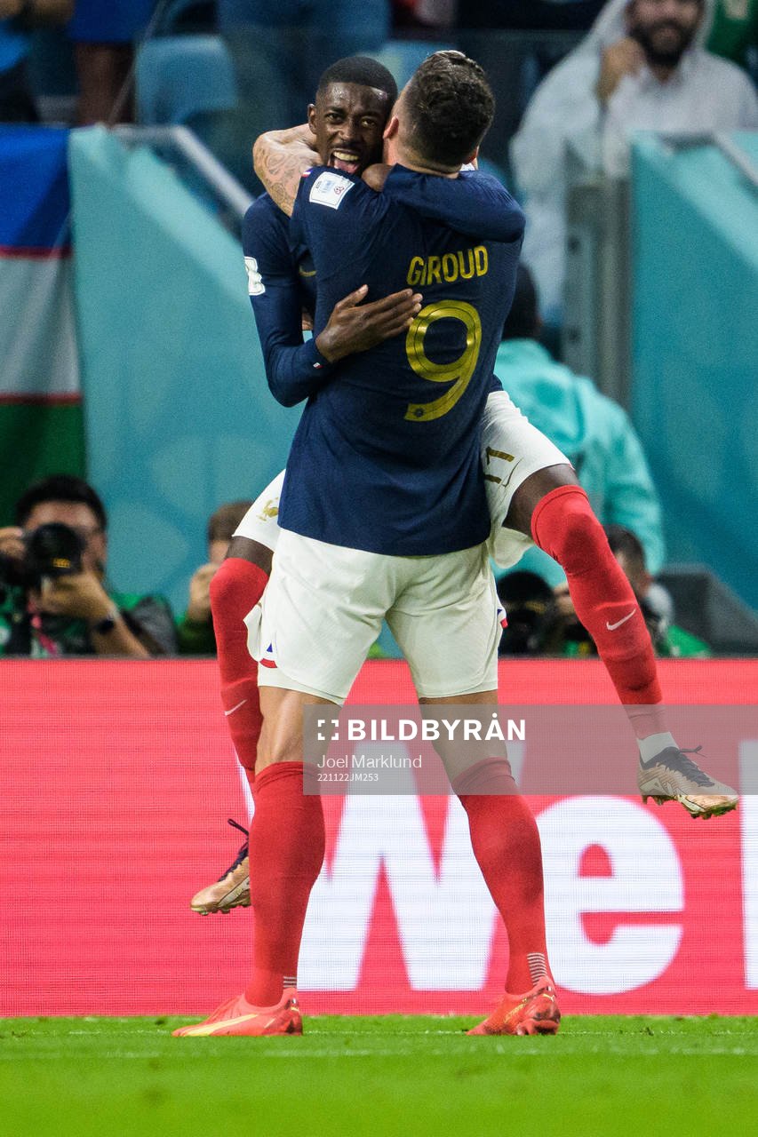 Ousmane Dembele and Olivier Giroud of France celebrate the