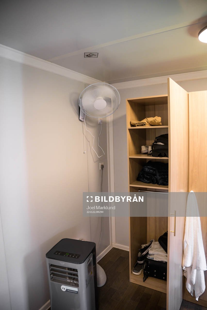 A fan and air cooling device in a room at Fan Village