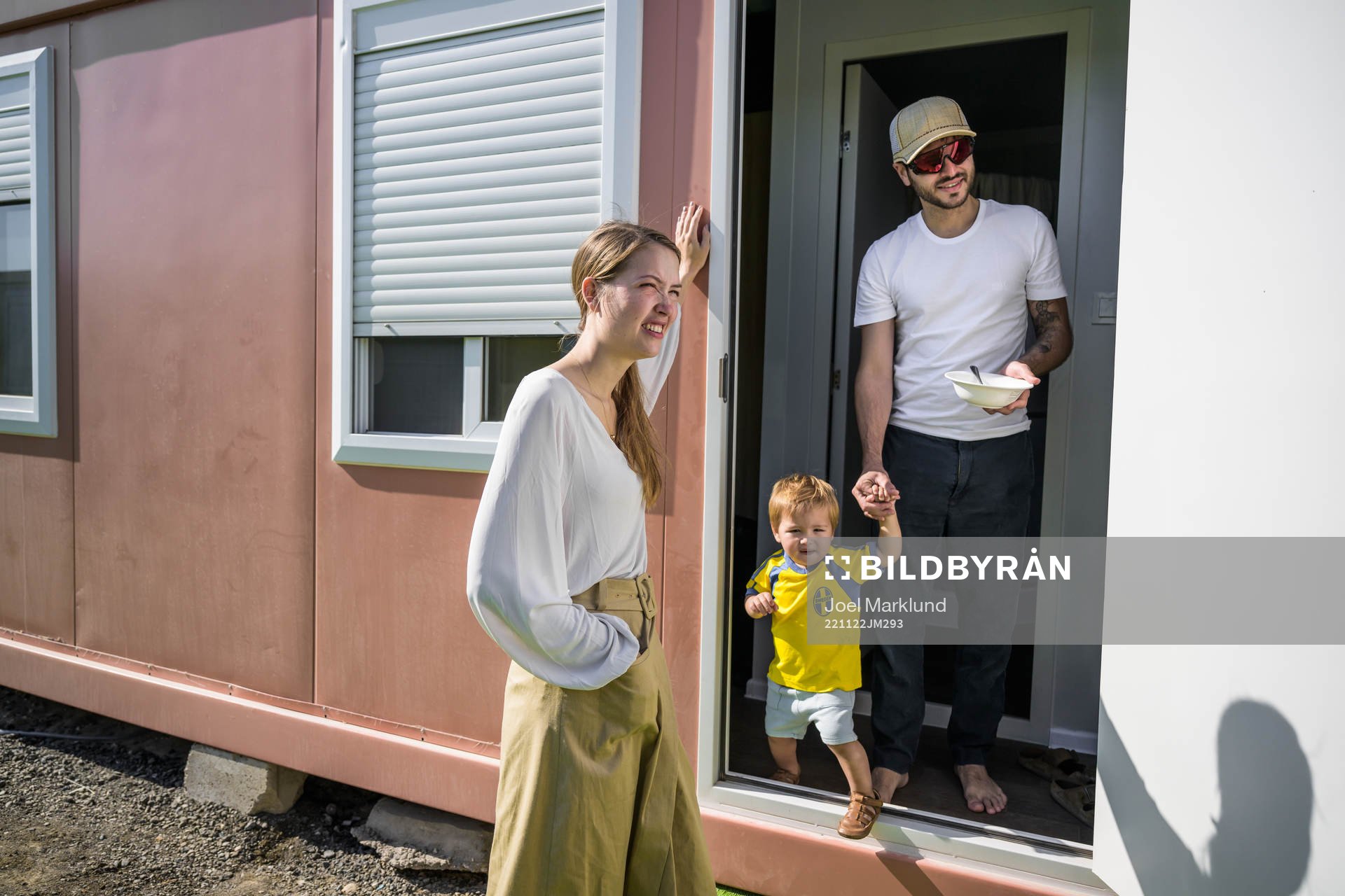 Cecilia Alfsdotter and Juan Pablo together with their kid León outside their room at Fan Village Cabins Free Zone during day 3 of the FIFA World Cup 2022 on November 22, 2022 in Doha.