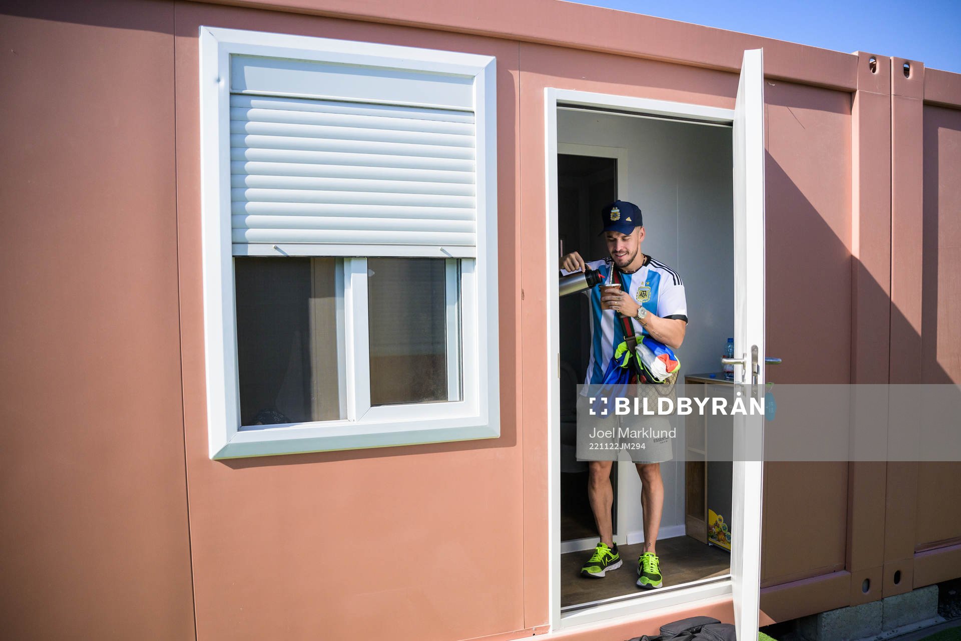 Nico Lorenzonn from Argentina pours tea in the doorway to