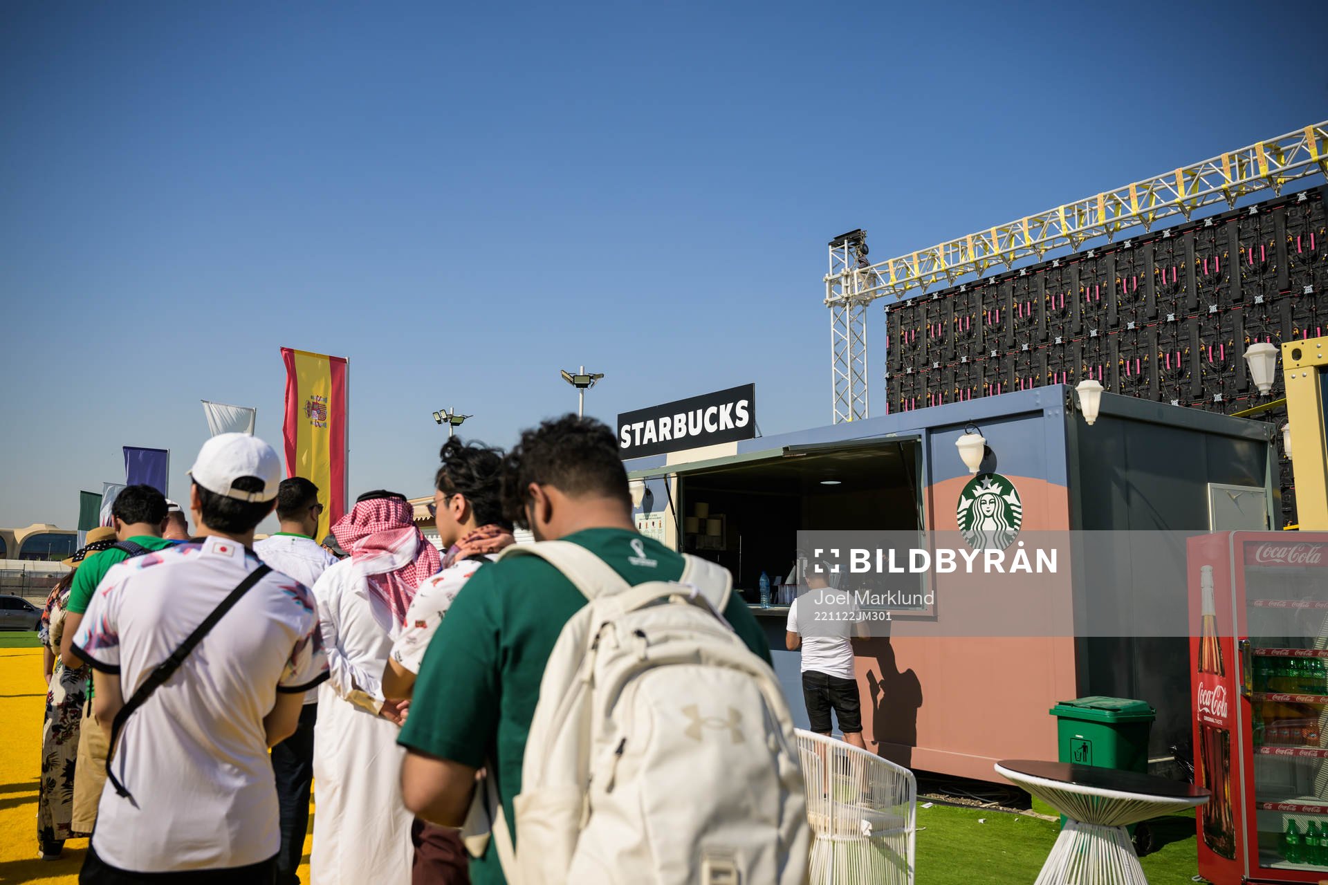 People cue to a Starbucks at Fan Village Cabins Free Zone during day 3 of the FIFA World Cup 2022 on November 22, 2022 in Doha.