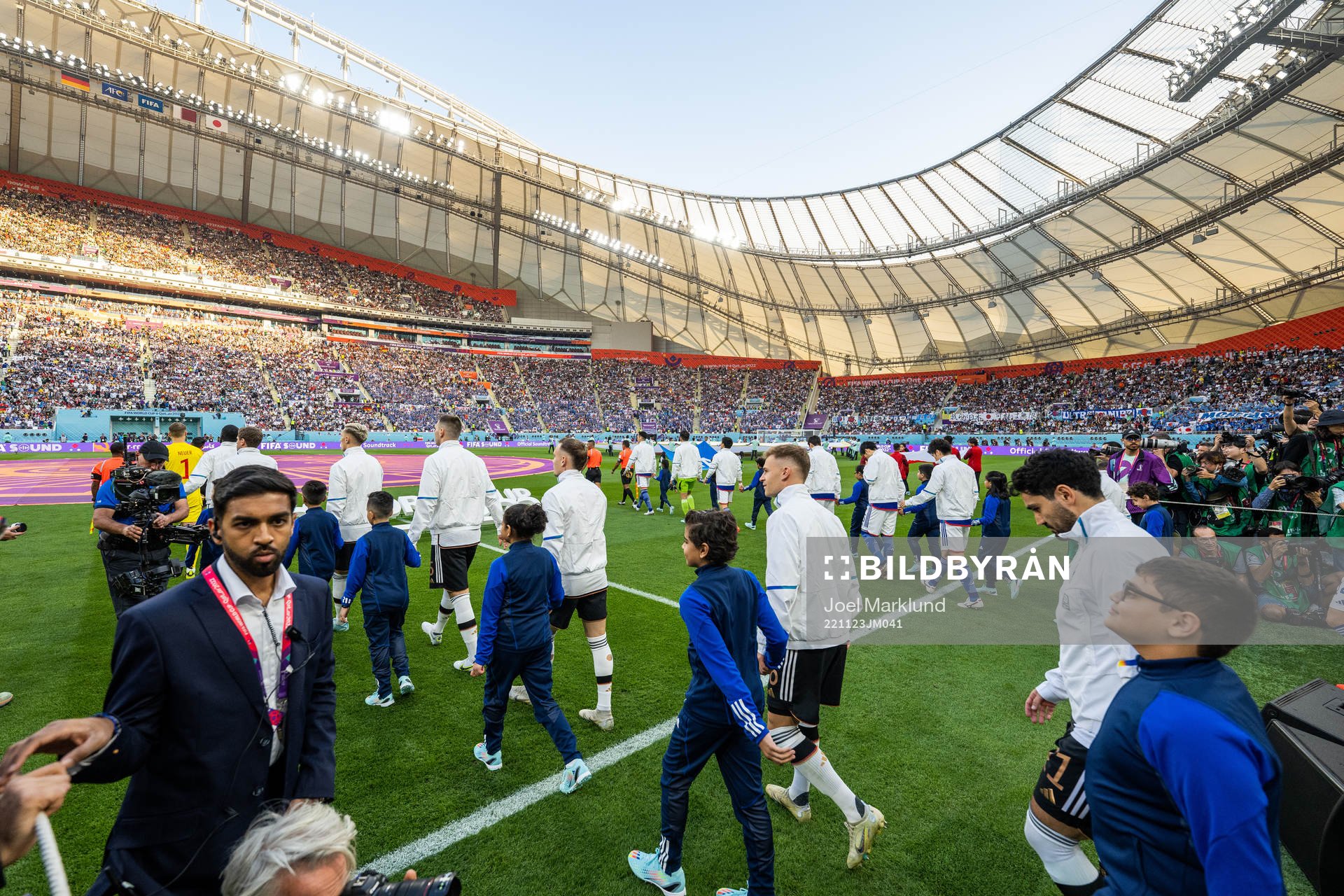 Players of Germany and Japan enters the pitch