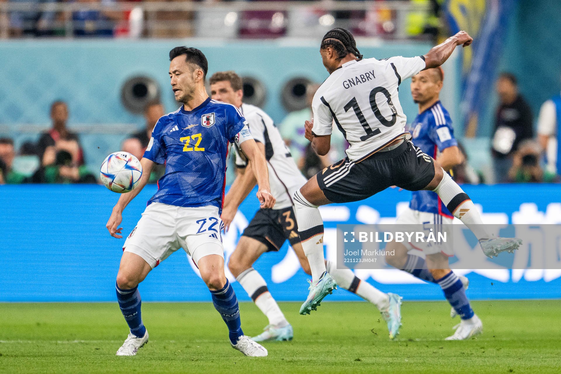 Maya Yoshida of Japan and Serge Gnabry of Germany
