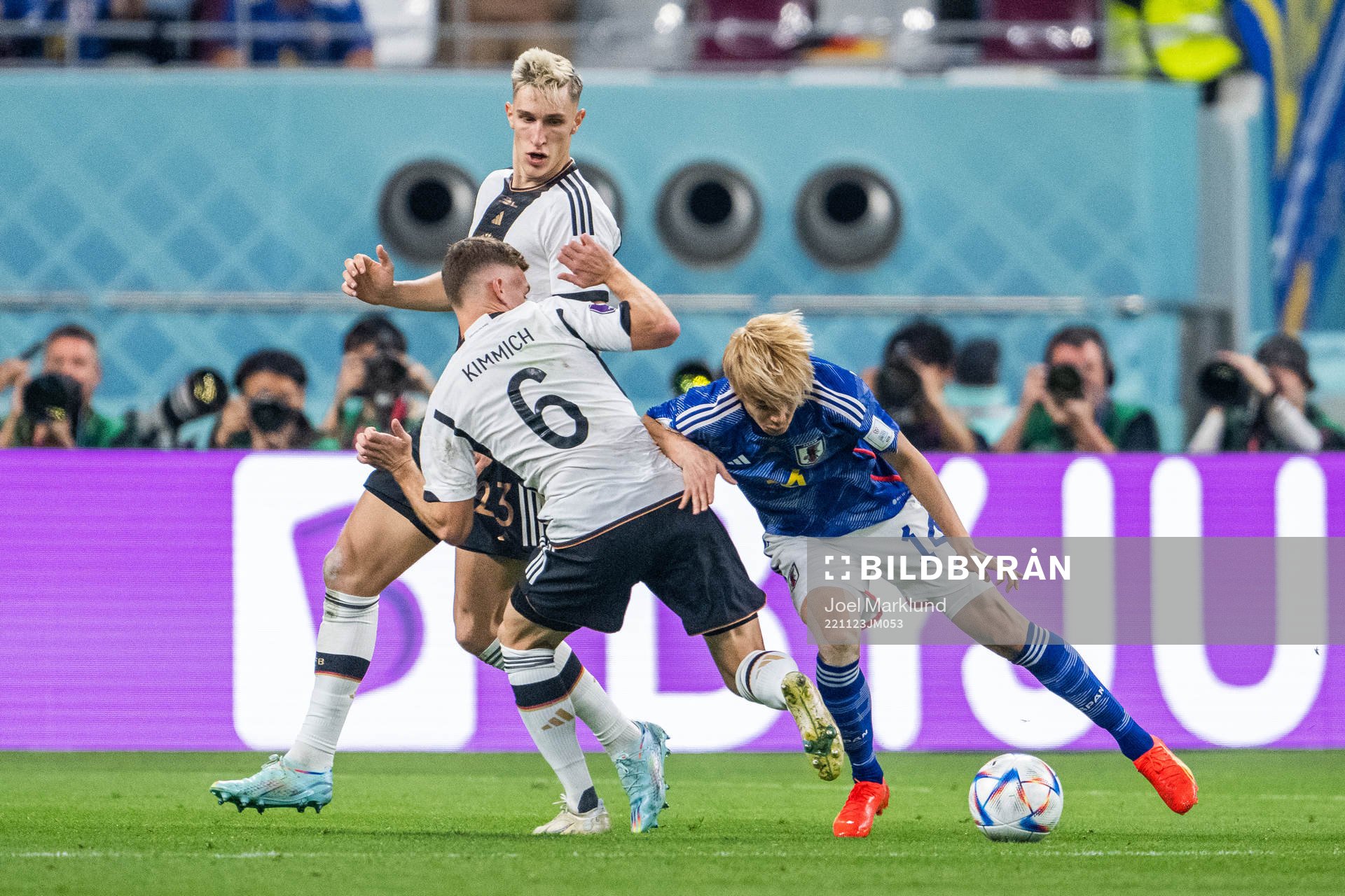 Nico Schlotterbeck and Joshua Kimmich of Germany with Junya