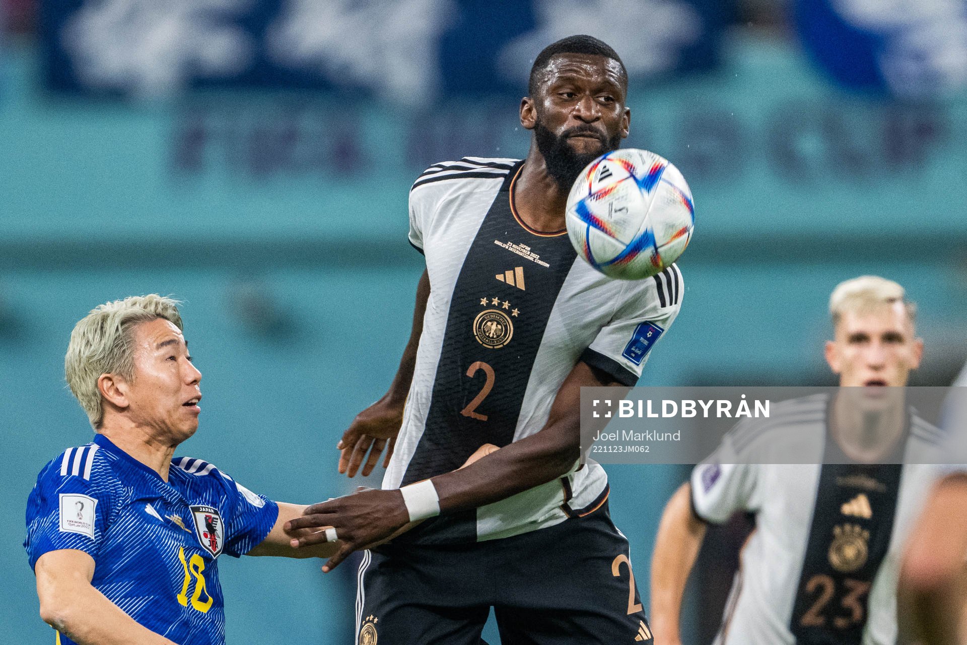 Takuma Asano of Japan and Antonio Rüdiger of Germany