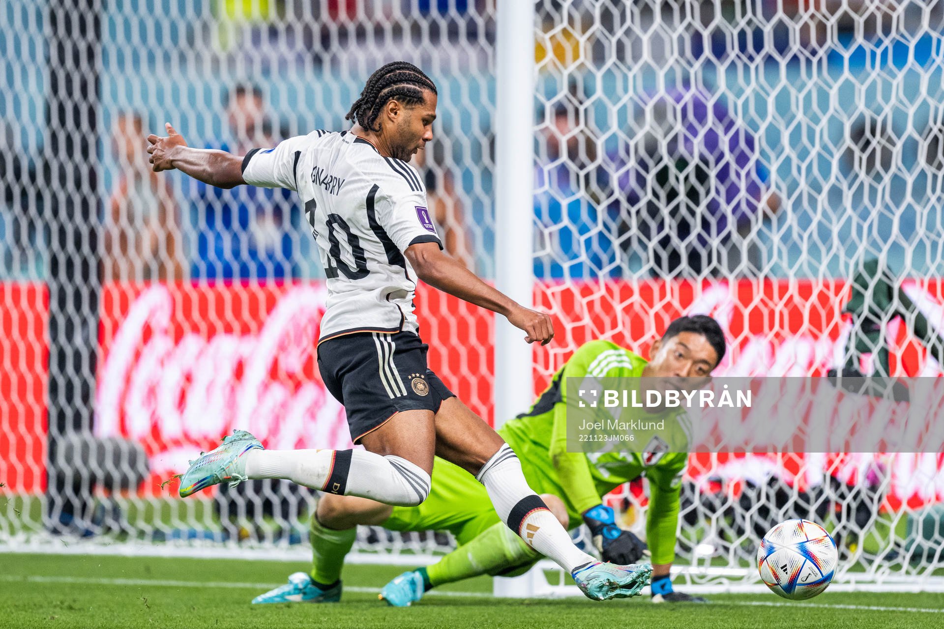 Serge Gnabry of Germany and goalkeeper Shuichi Gonda of