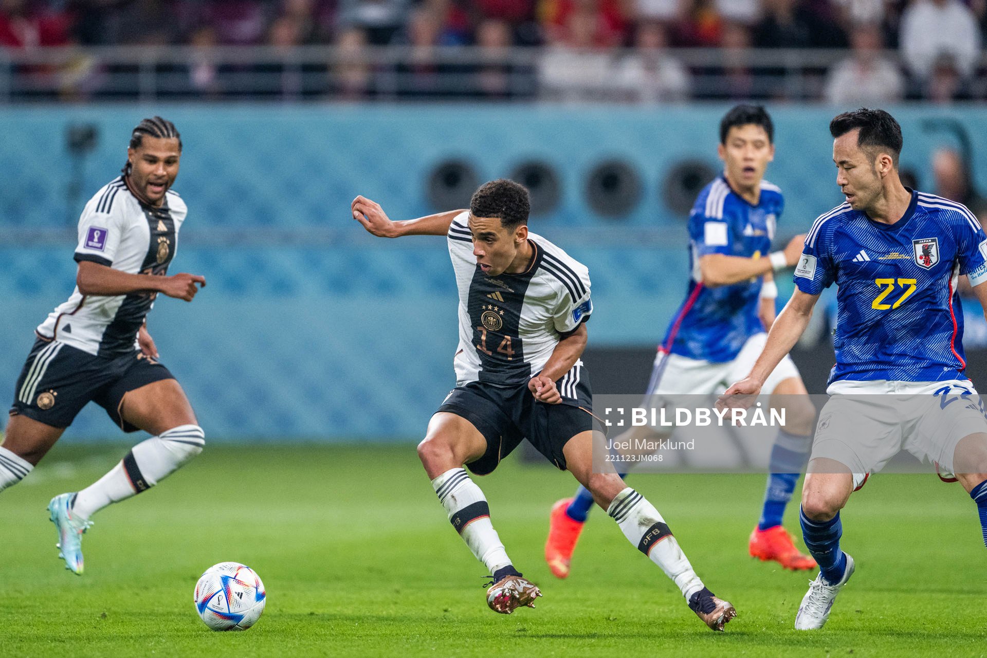 Jamal Musiala of Germany and Maya Yoshida of Japan