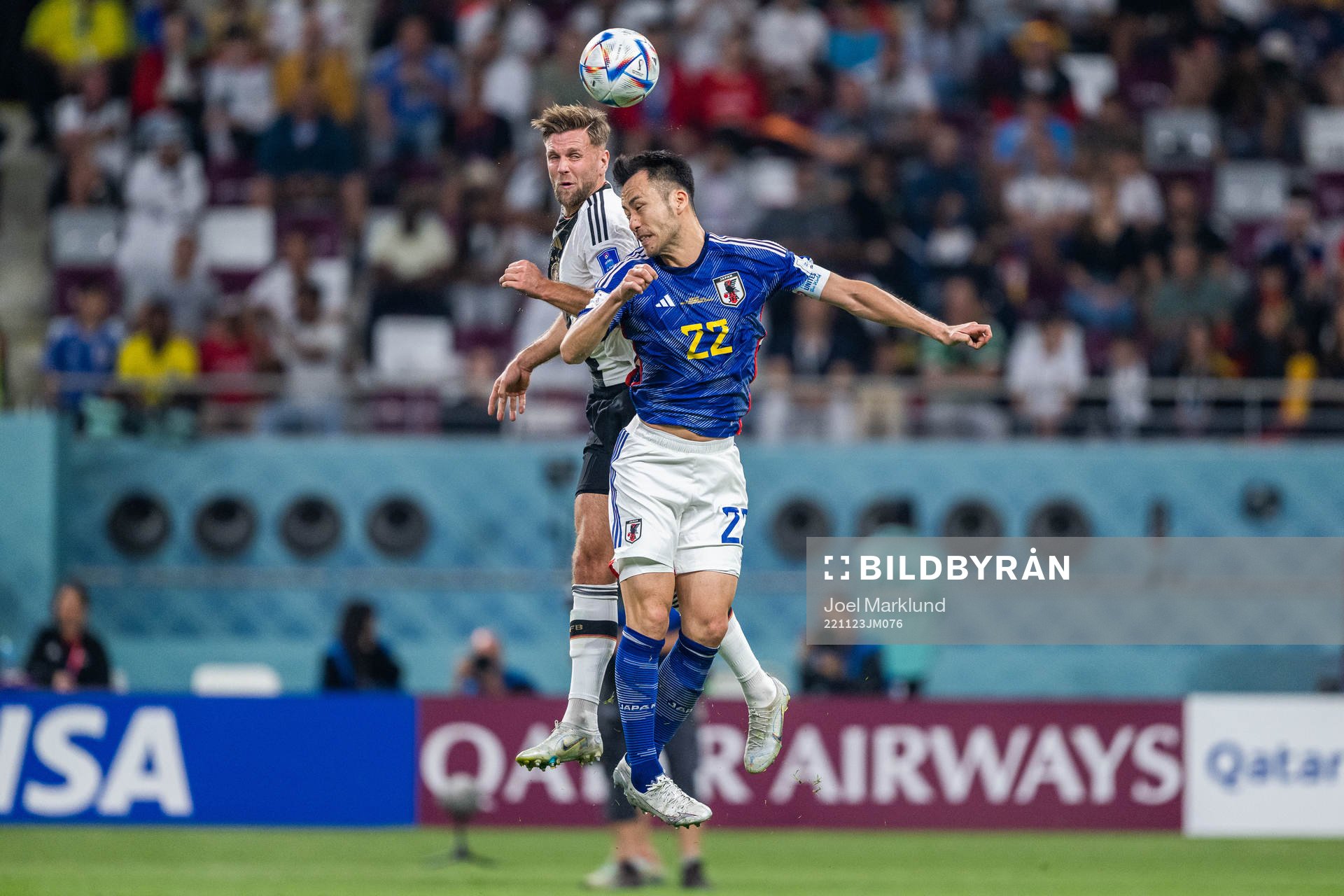 Niclas Füllkrug of Germany and Maya Yoshida of Japan