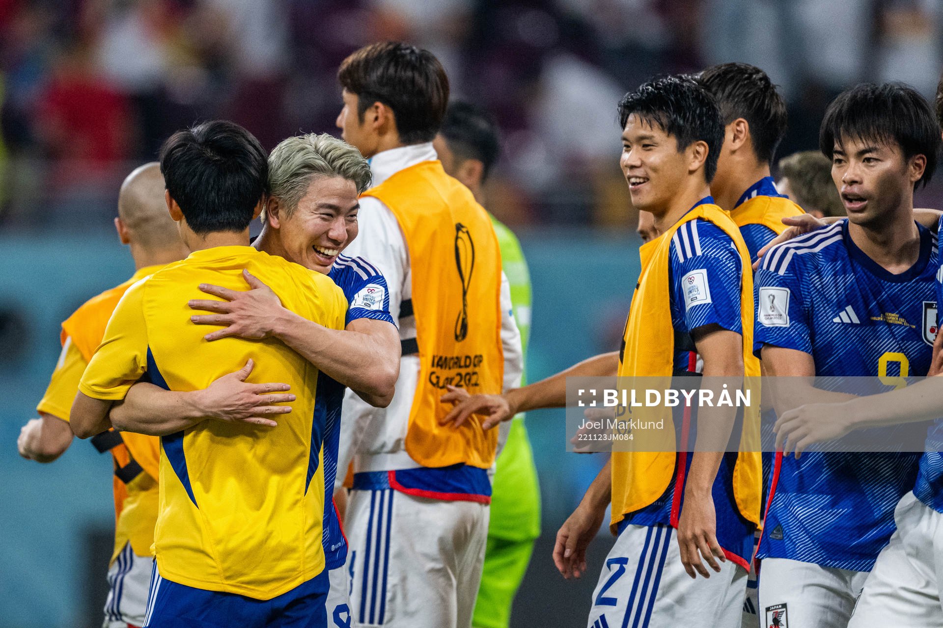 Takuma Asano of Japan celebrates with team mates