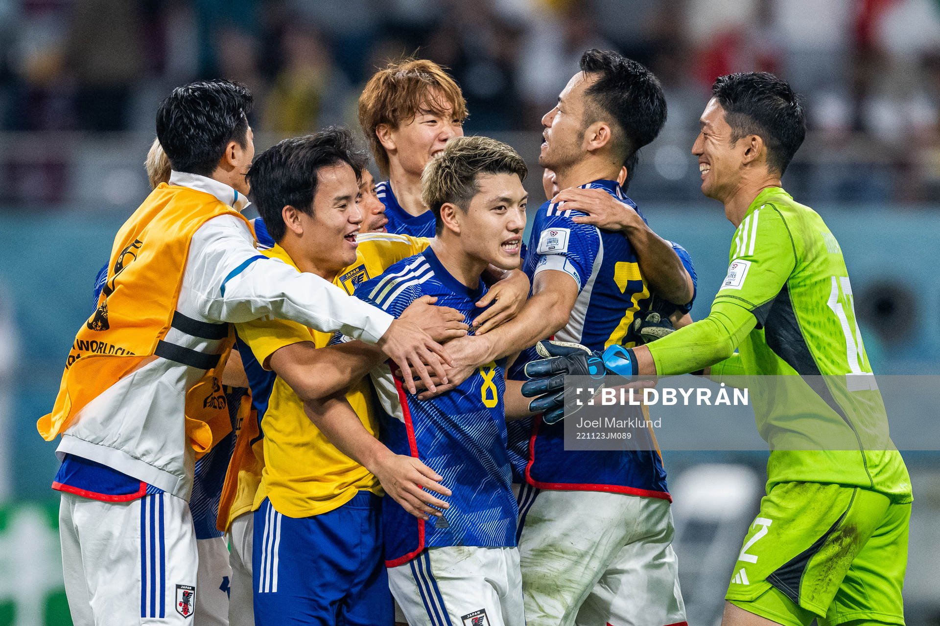Ritsu Doan of Japan celebrates with team mates