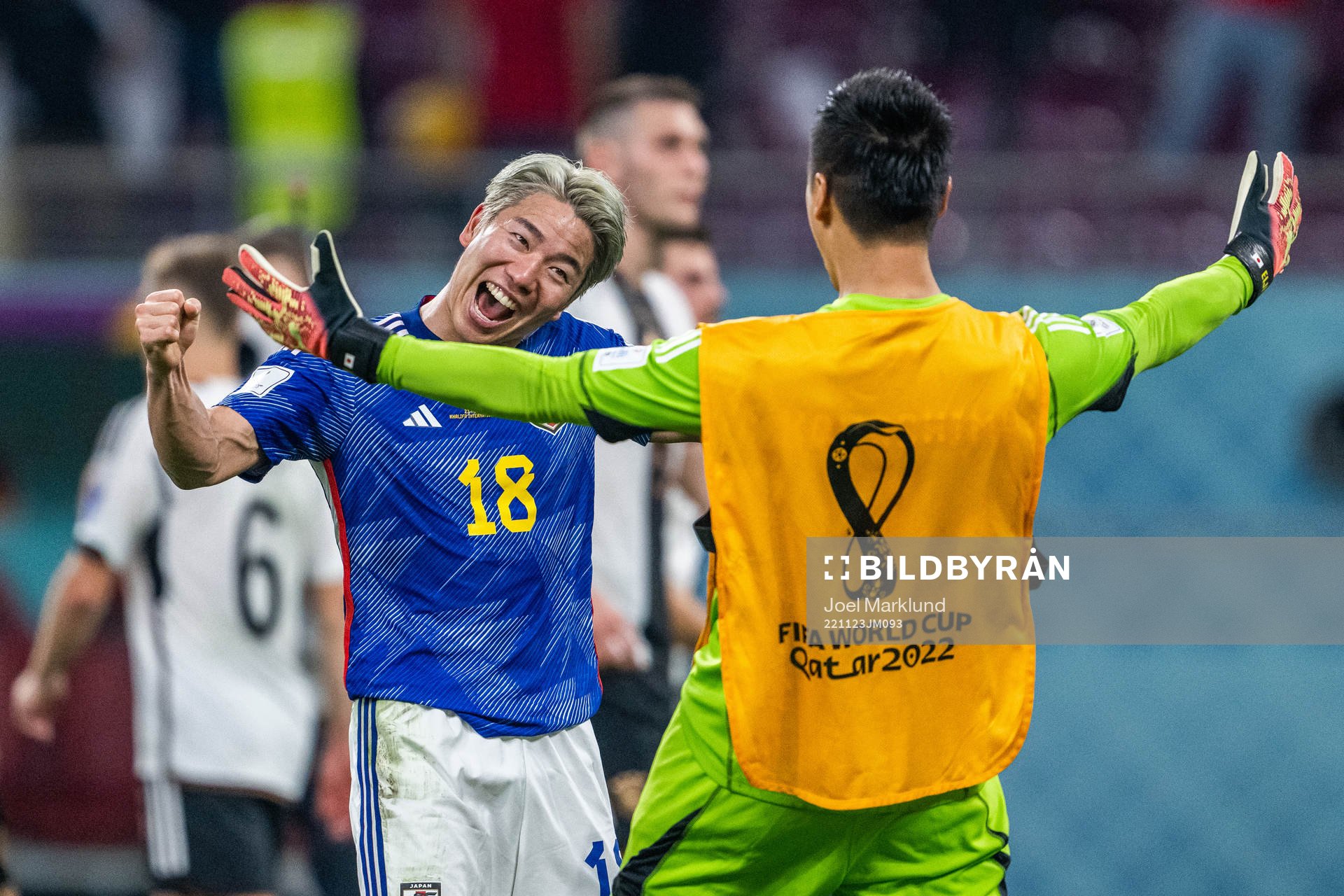 Takuma Asano of Japan celebrates with a team mate