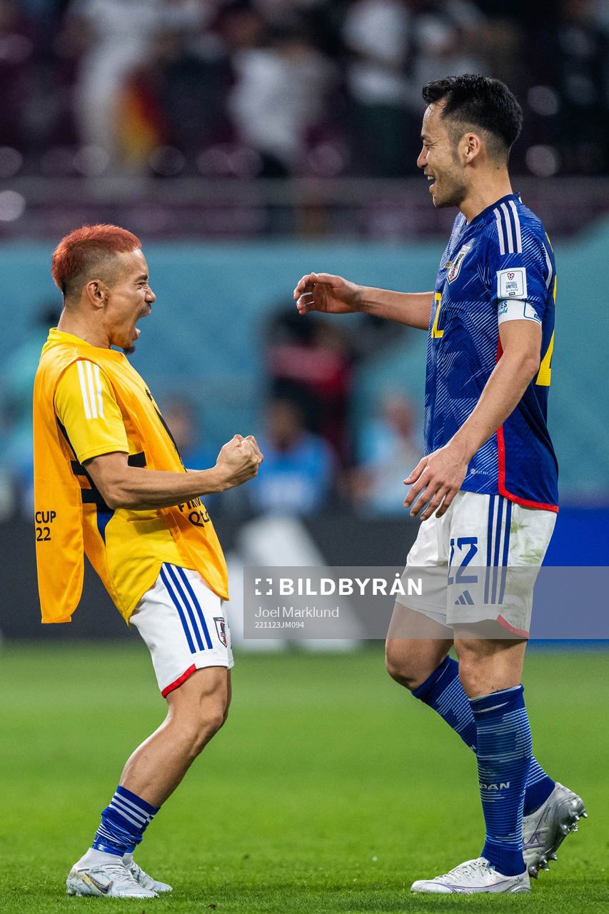 Yuto Nagatomo and Maya Yoshida of Japan celebrate