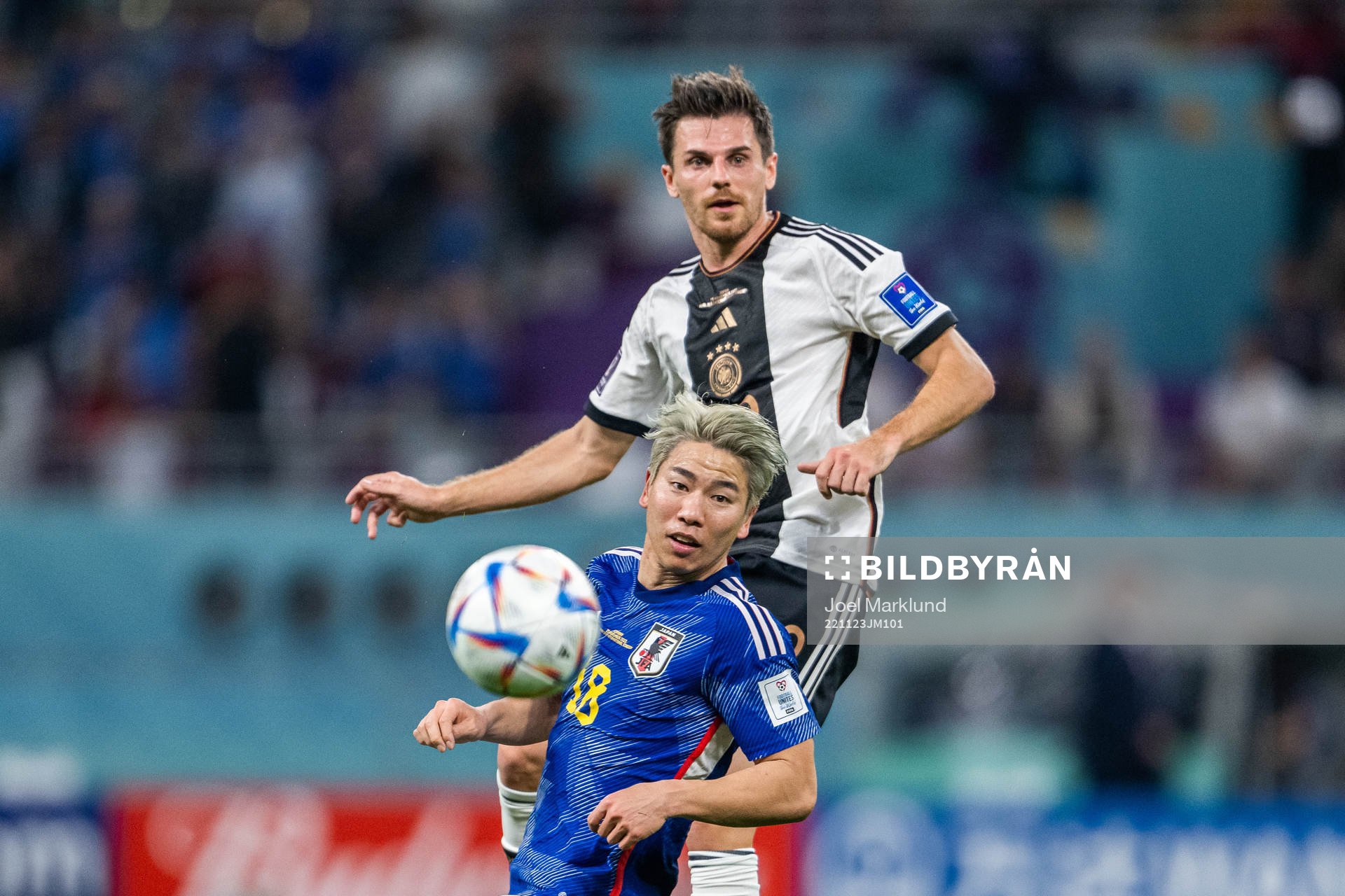 Takuma Asano of Japan and Jonas Hofmann of Germany