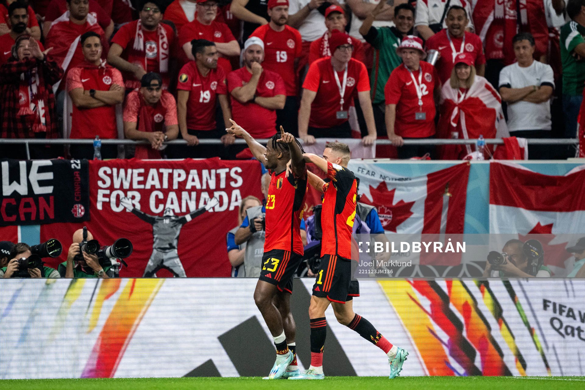 Michy Batshuayi of Belgium celebrates with Timothy Castagne