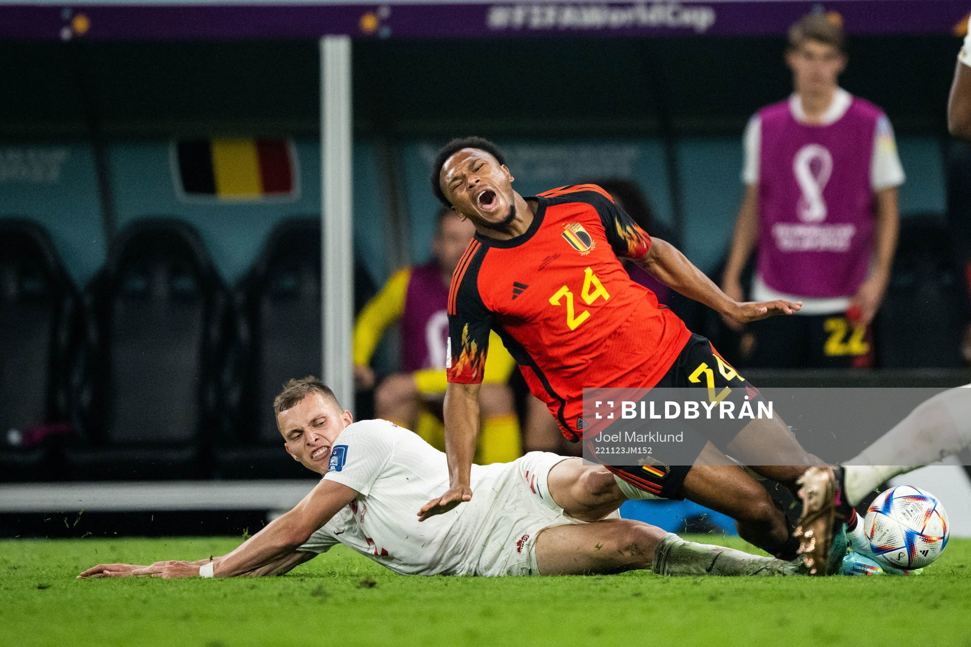 Alistair Johnston of Canada tackles Lois Openda of Belgium