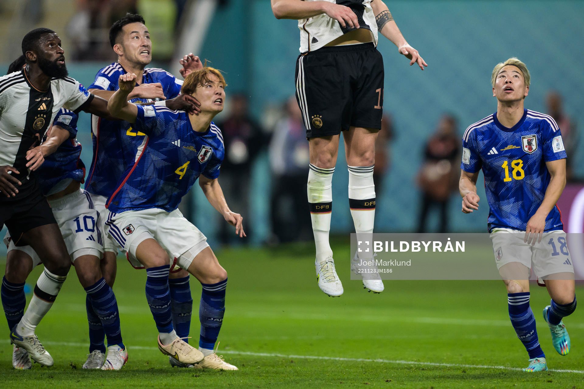 Antonio Rüdiger of Germany and Maya Yoshida, Kou Itakura and Takuma Asano of Japan see Niklas Süle of Germany jump for a header during the FIFA World Cup 2022 football match between Germany and Japan on November 23, 2022 in Doha.