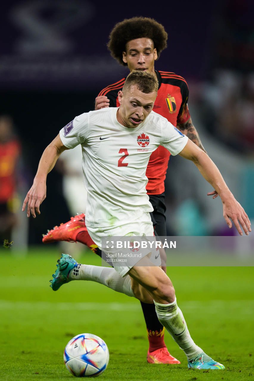 Alistair Johnston of Canada and Axel Witsel of Belgium
