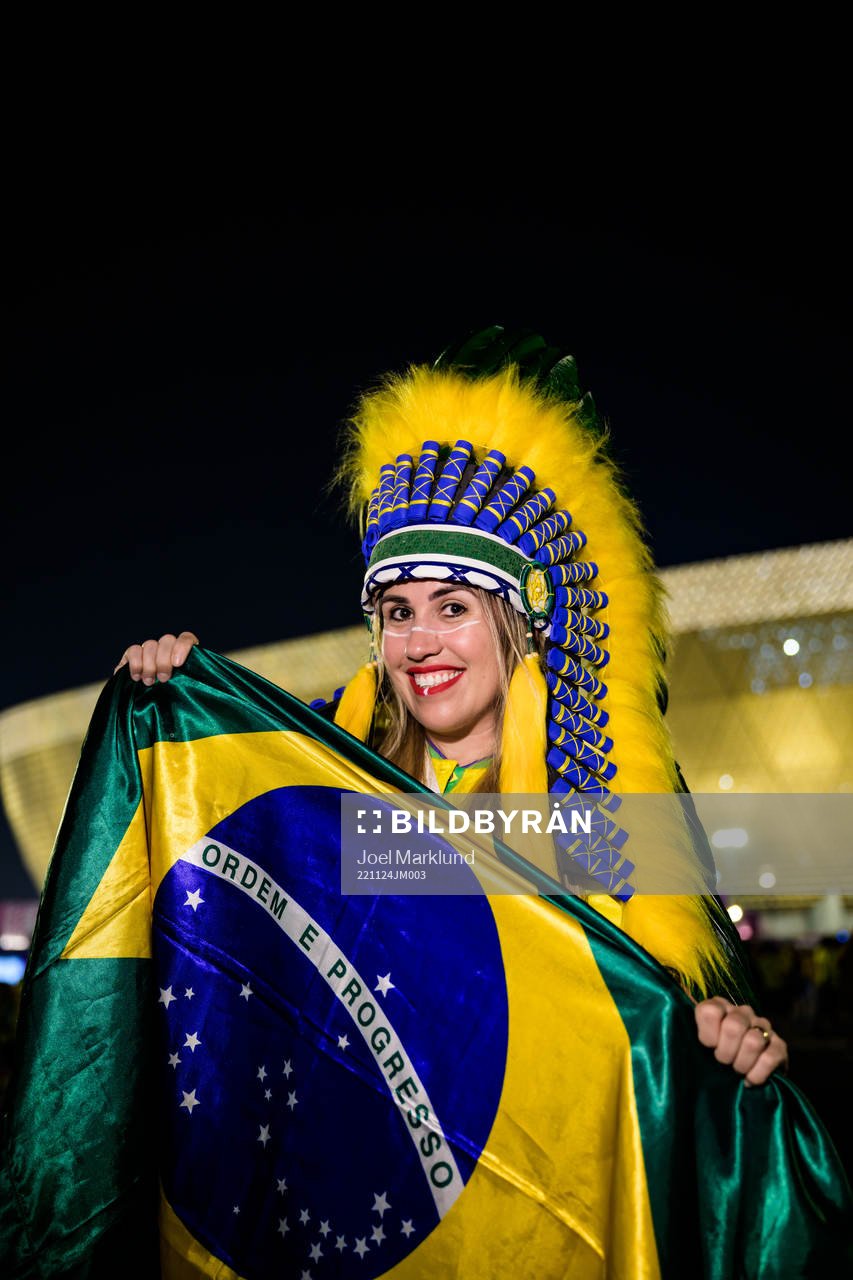 A Brazilian fan poses for a portrait