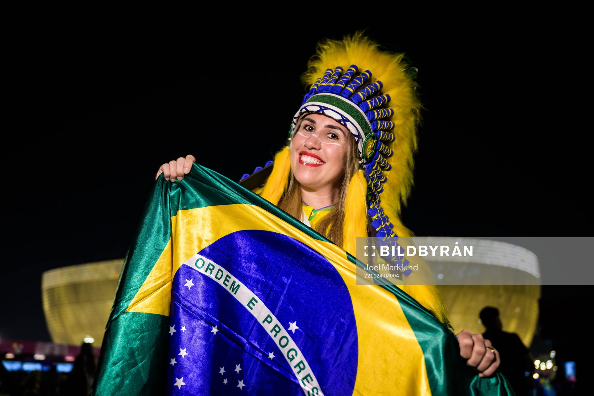 A Brazilian fan poses for a portrait