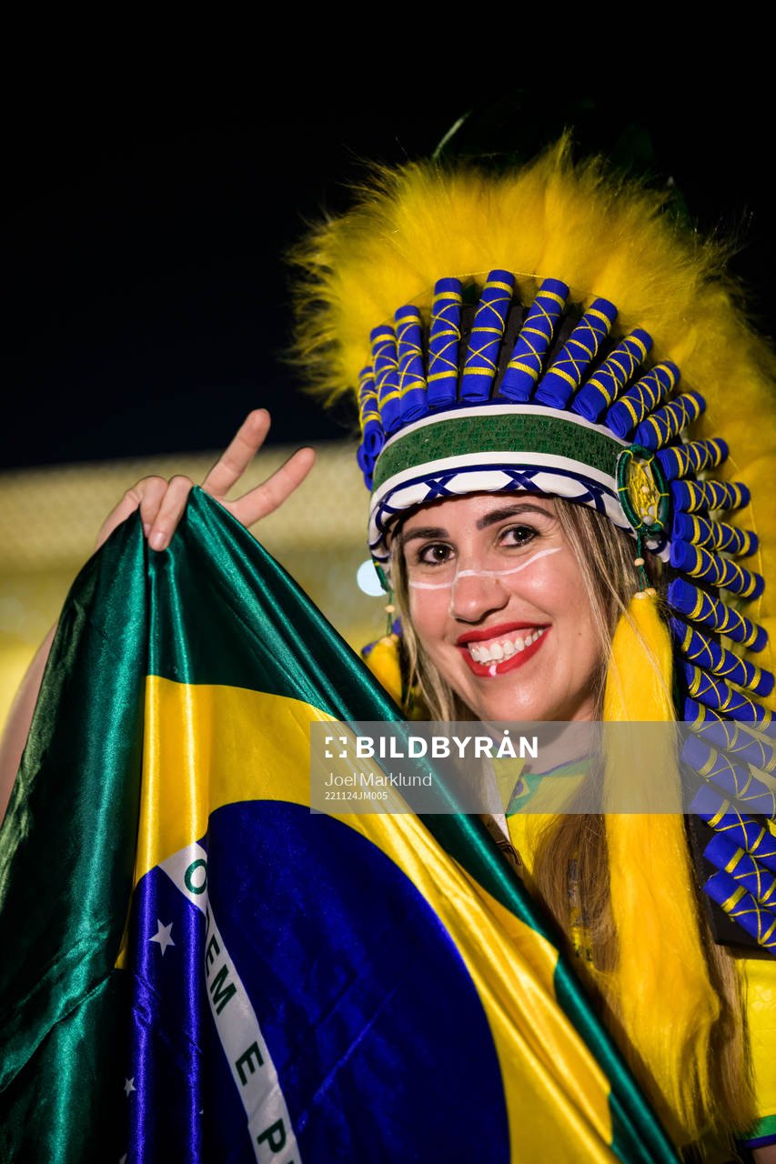 A Brazilian fan poses for a portrait