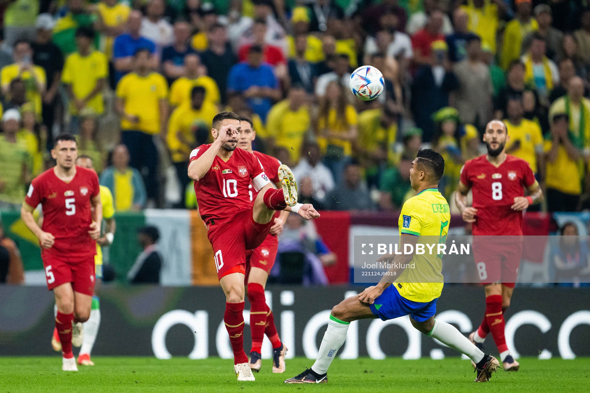 Dusan Tadic of Serbia and Casemiro of Brazil