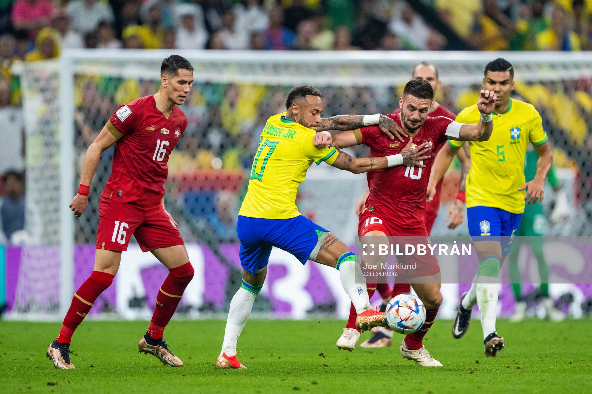 Sasa Lukic and Dusan Tadic of Serbia compete for the ball with Neymar of Brazil during the FIFA World Cup 2022 football match between Brazil and Serbia on November 24, 2022 in Doha.