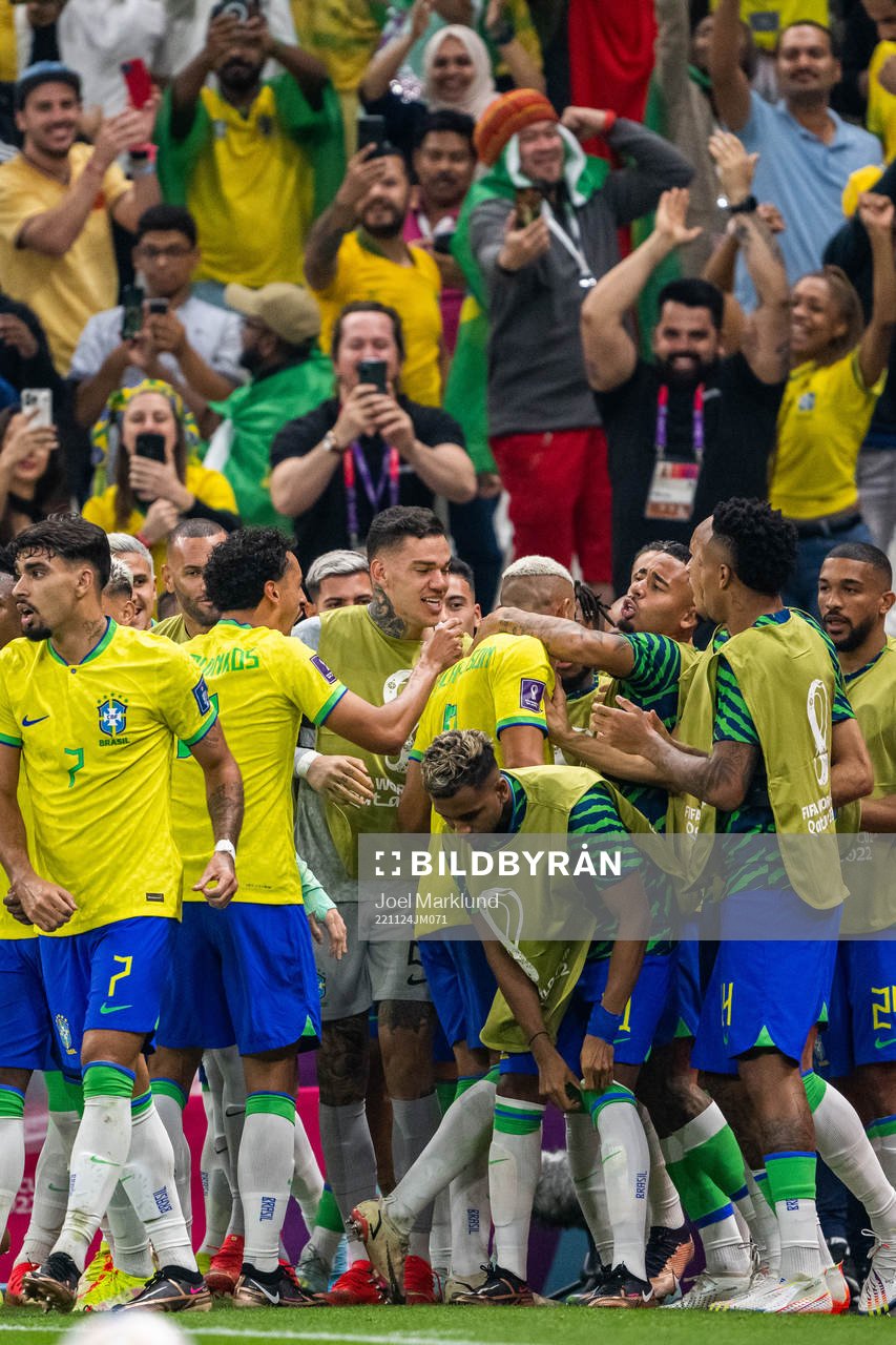 Richarlison of Brazil celebrates with team mates