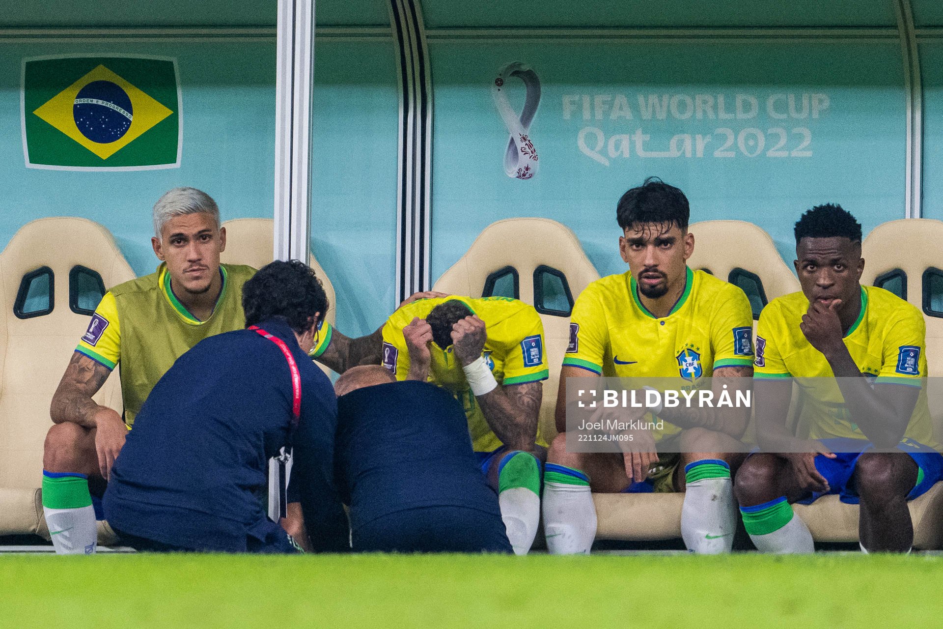 Neymar of Brazil receives medical attention