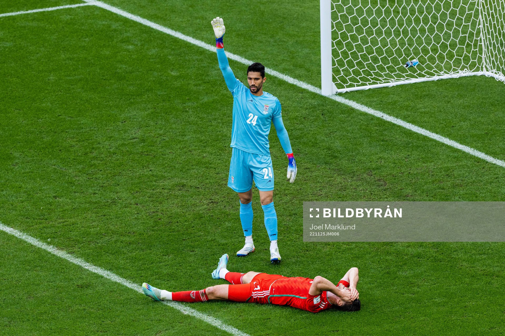goalkeeper Hossein Hosseini of Iran and Kieffer Moore of