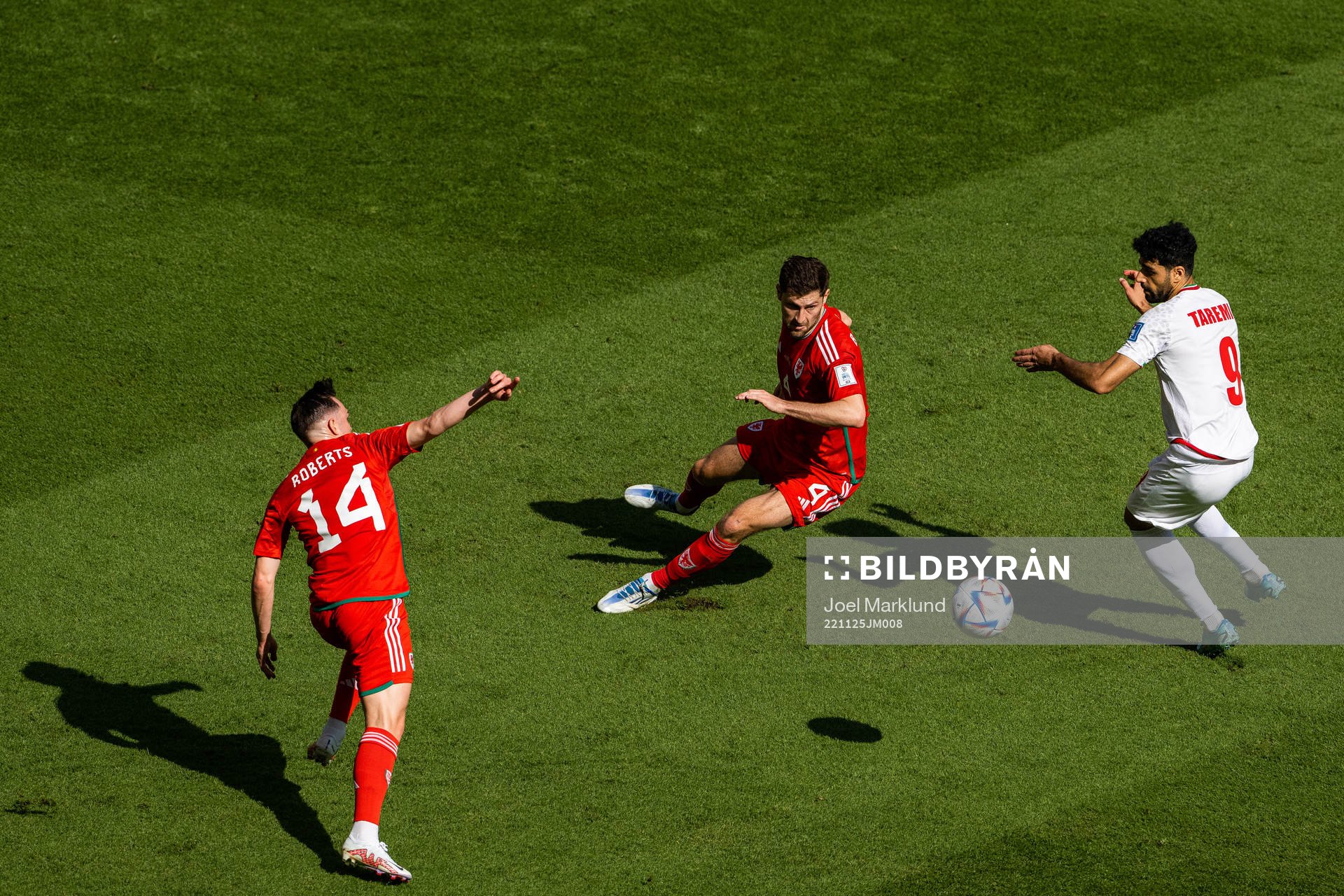 Connor Roberts and Ben Davies of Wales against Mehdi Taremi