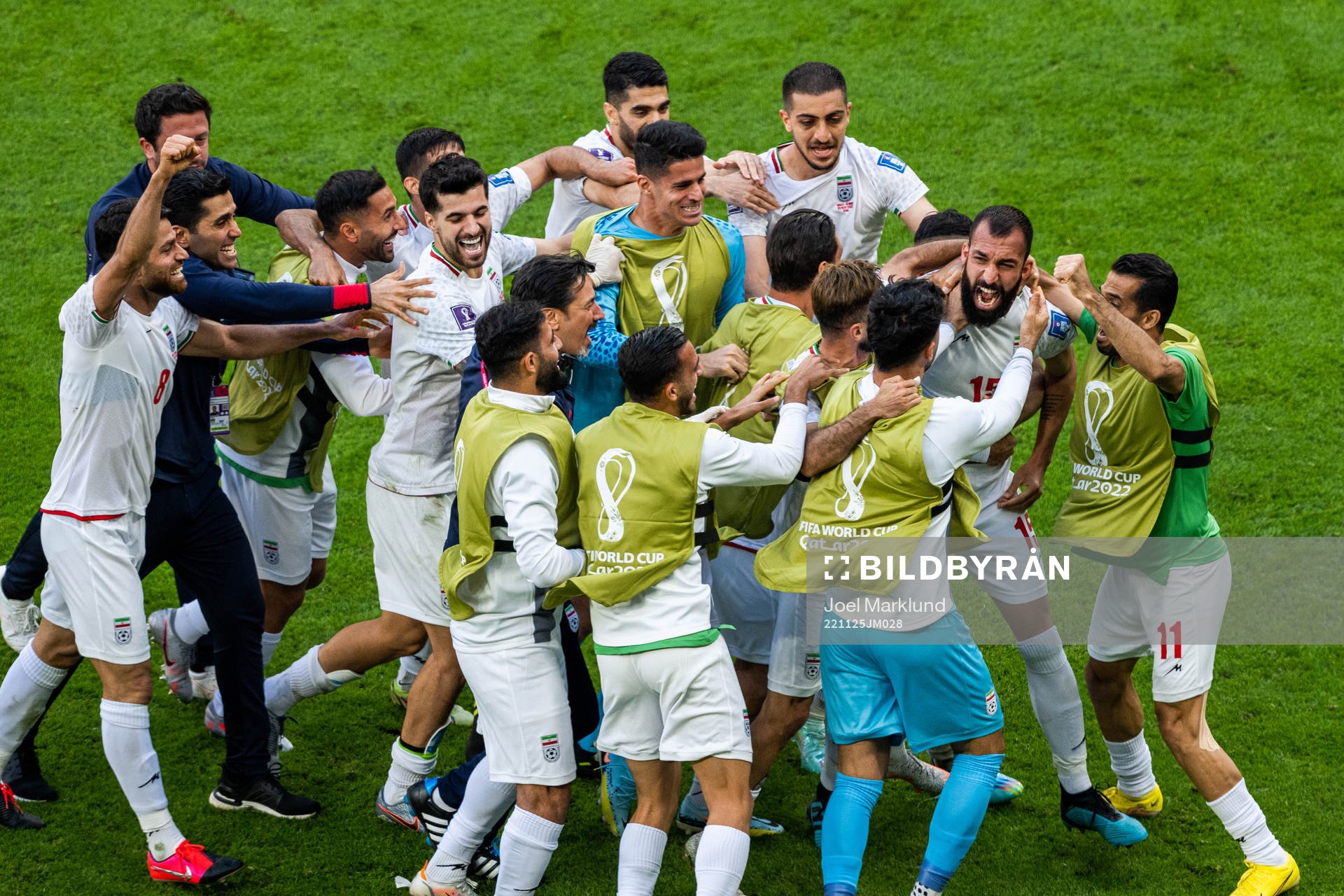 Rouzbeh Cheshmi of Iran celebrates with team mates