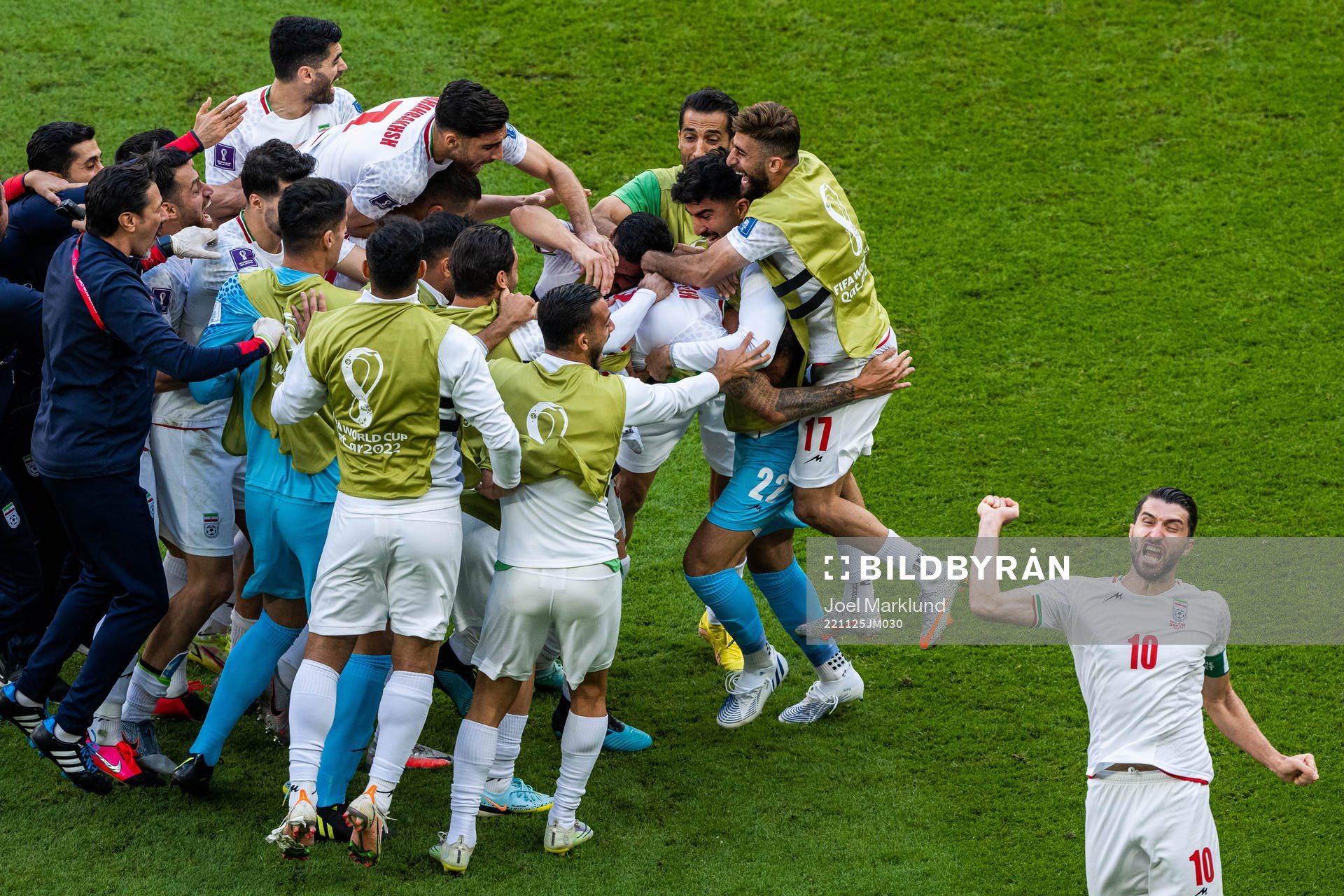 Rouzbeh Cheshmi of Iran celebrates with team mates