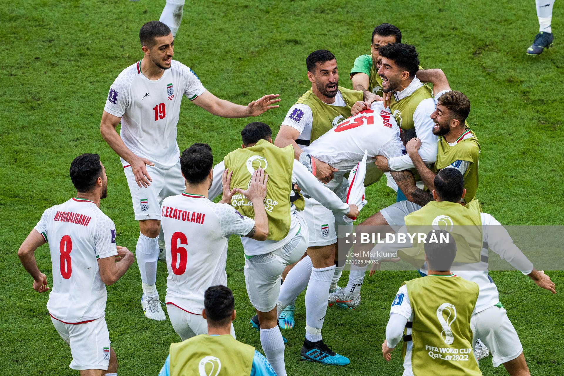 Rouzbeh Cheshmi of Iran celebrates with team mates