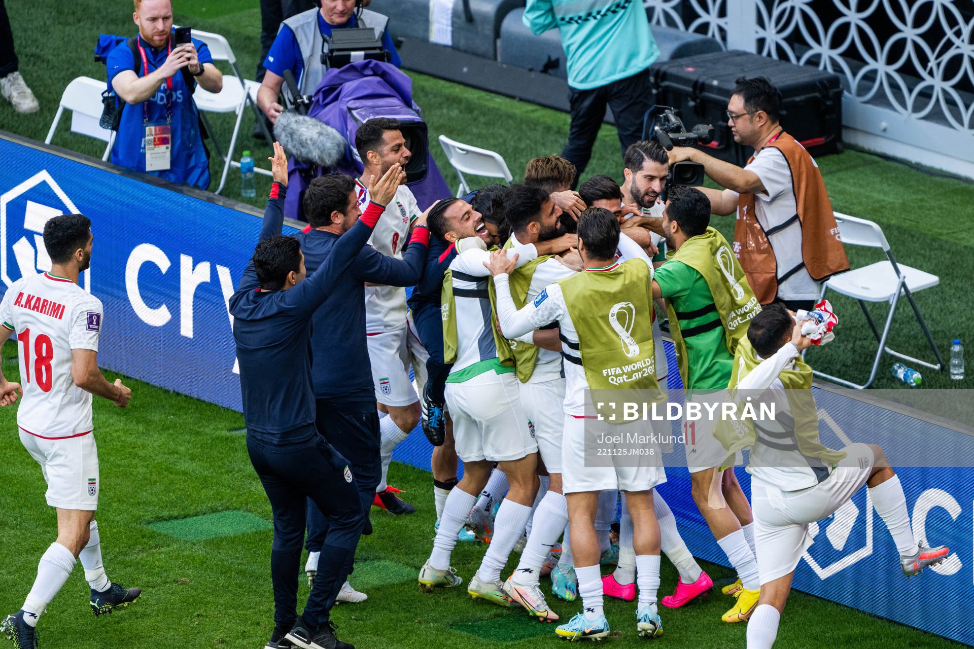 Ramin Rezaeian of Iran celebrates with team mates after scoring 0-2 during the FIFA World Cup 2022 football match between Wales and Iran on November 25, 2022 in Doha.