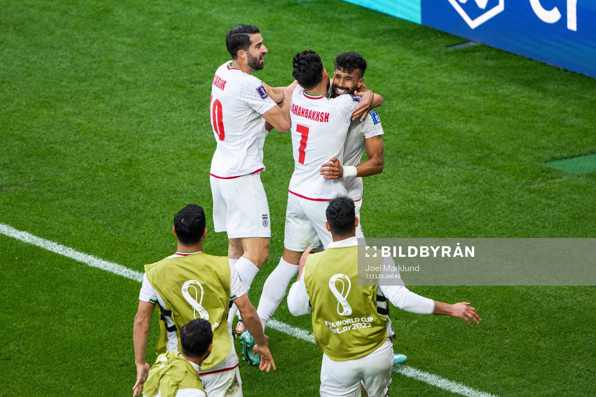 Ramin Rezaeian of Iran celebrates with Karim Ansarifard and