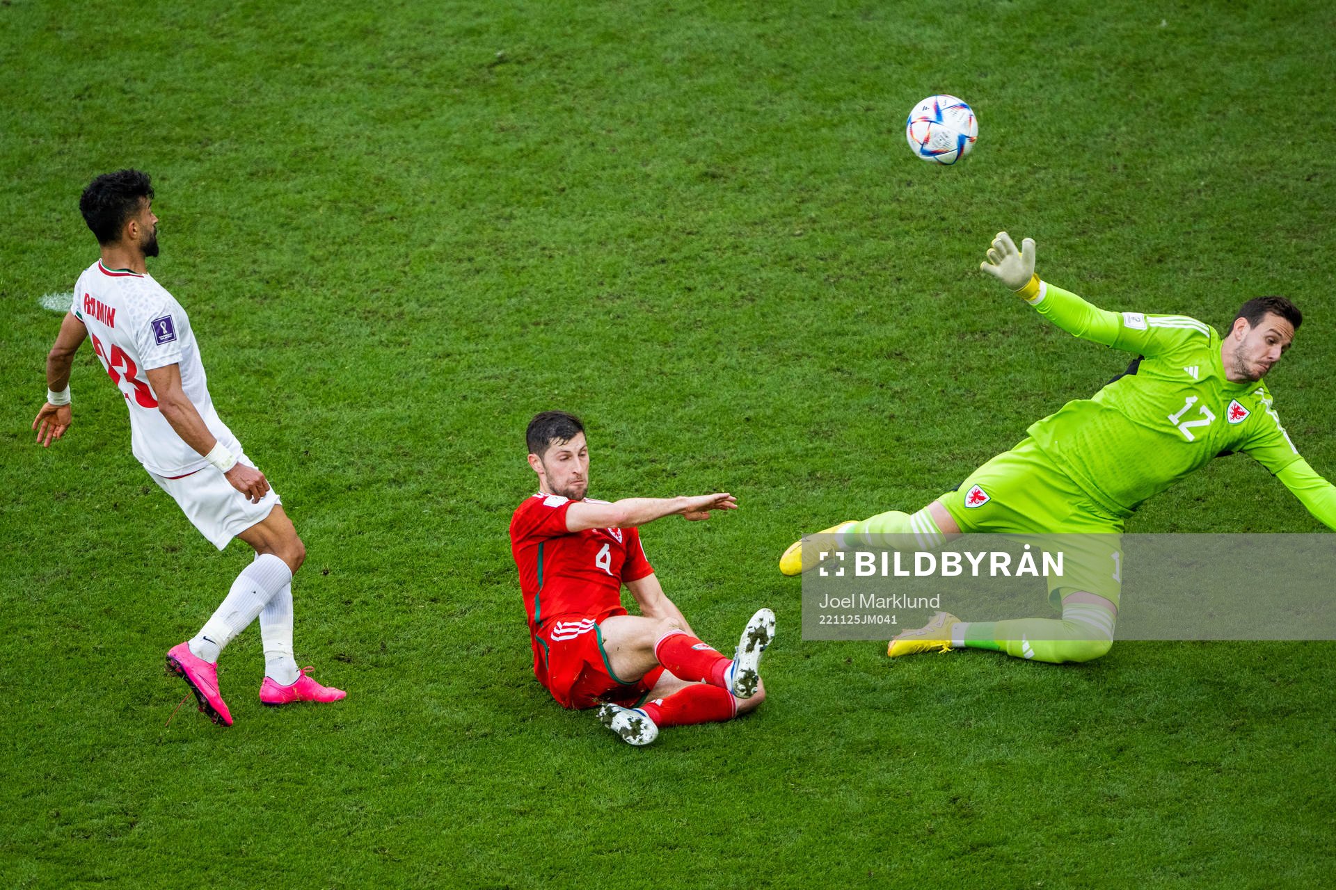 Ramin Rezaeian of Iran scores 0-2 behind Ben Davies and