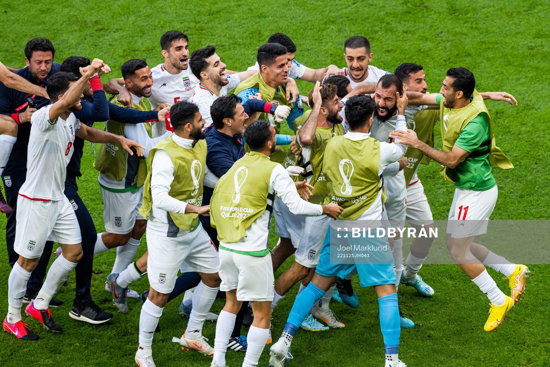 Rouzbeh Cheshmi of Iran celebrates with team mates after scoring 0-1 during the FIFA World Cup 2022 football match between Wales and Iran on November 25, 2022 in Doha.