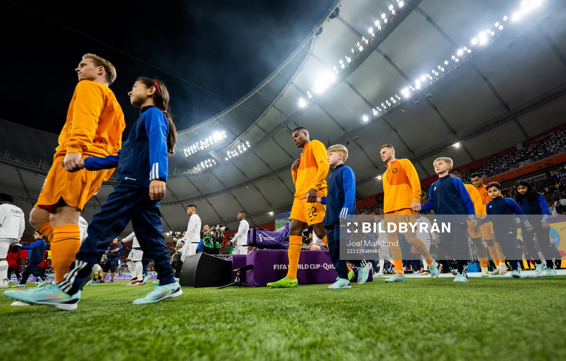 Players of Netherlands and of Ecuador enter the field for