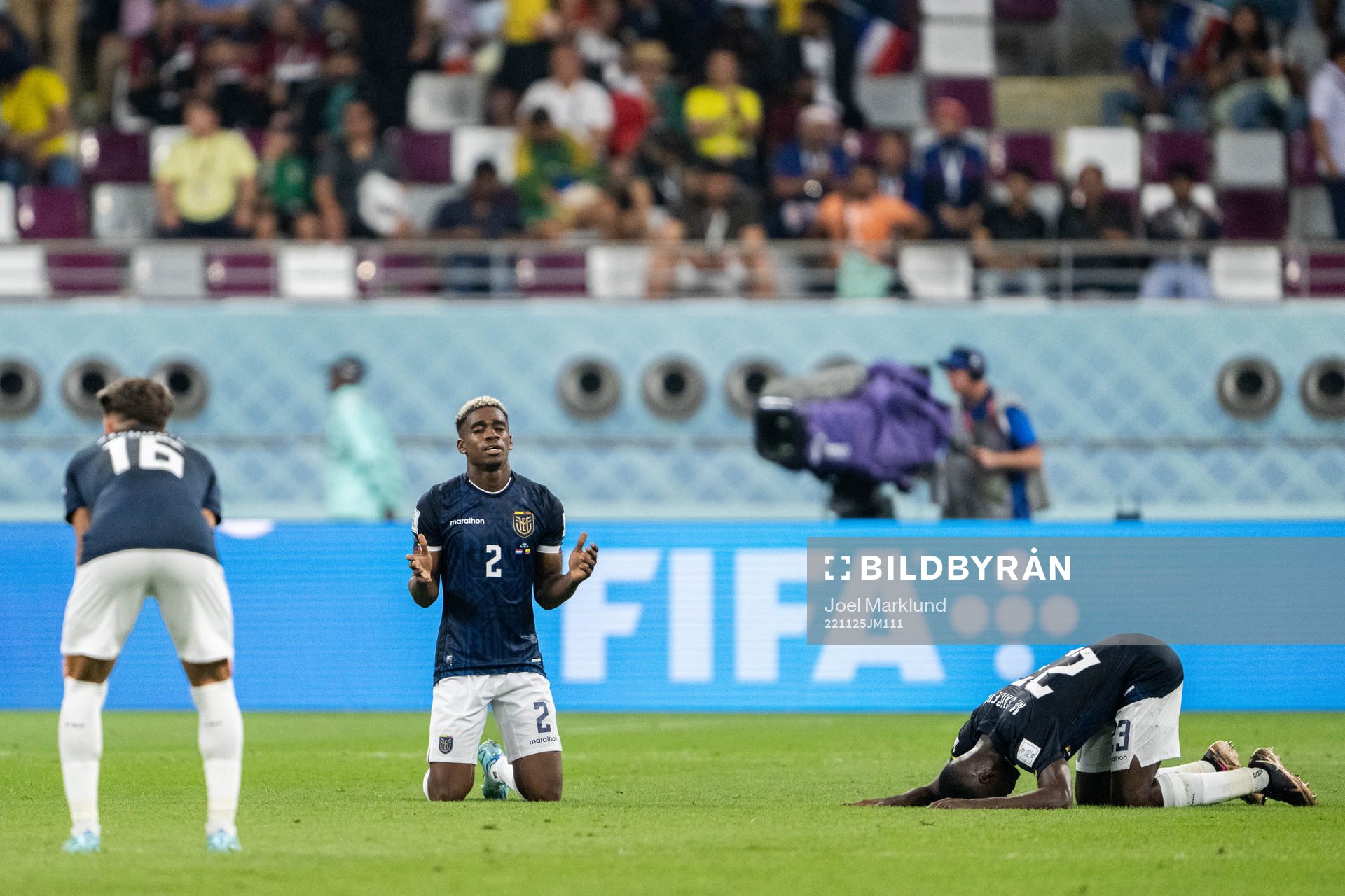 Felix Torres and Moises Caicedo of Ecuador pray after the FIFA World Cup 2022 football match between Netherlands and Ecuador on November 25, 2022 in Doha.