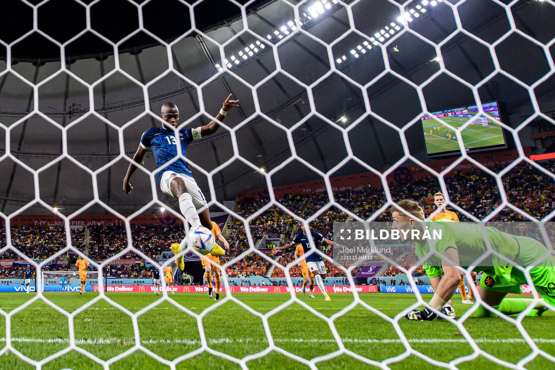 Enner Valencia of Ecuador scores 1-1 behind goalkeeper