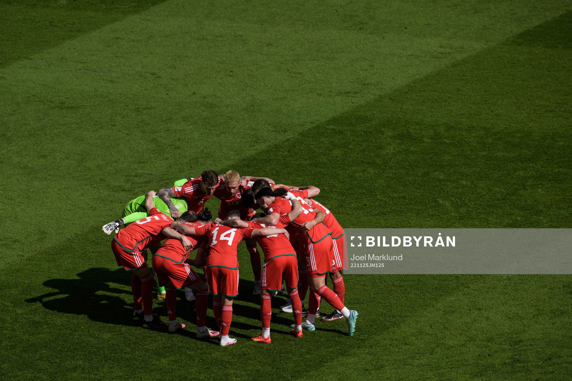 The players of Wales huddle
