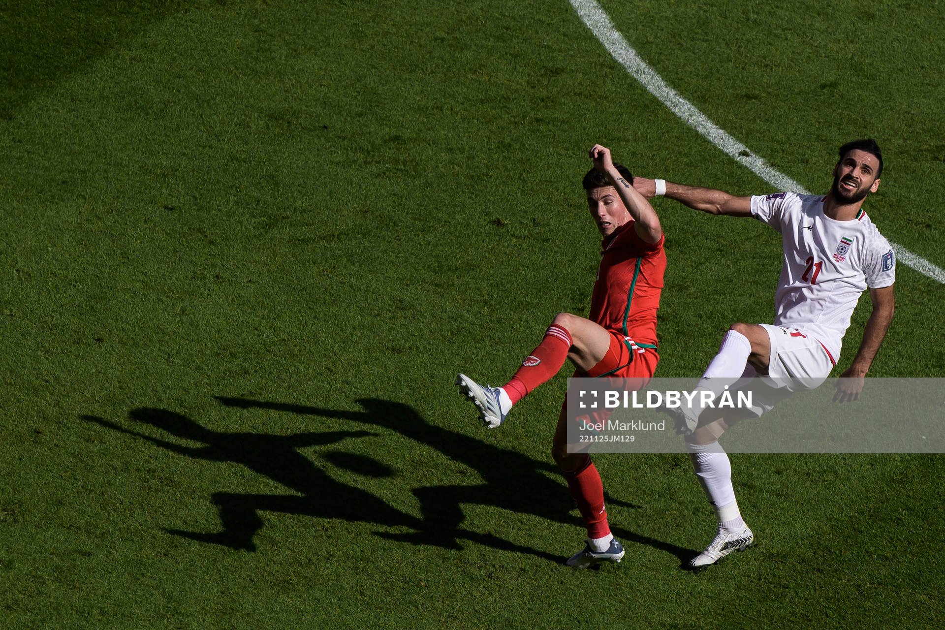 Harry Wilson of Wales and Ahmad Noorollahi of Iran during the FIFA World Cup 2022 football match between Wales and Iran on November 25, 2022 in Doha.