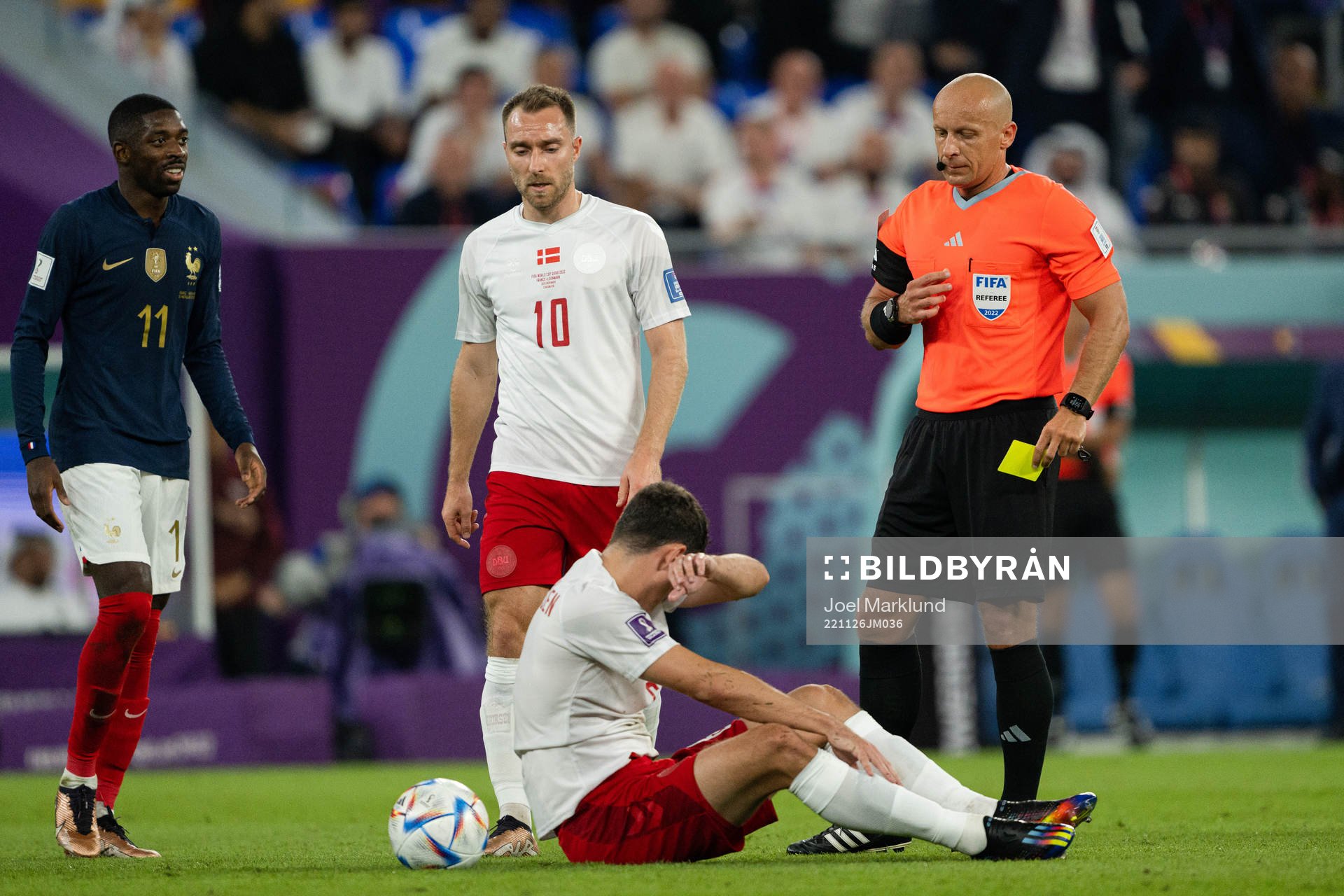 Andreas Christensen of Denmark receives a yellow card
