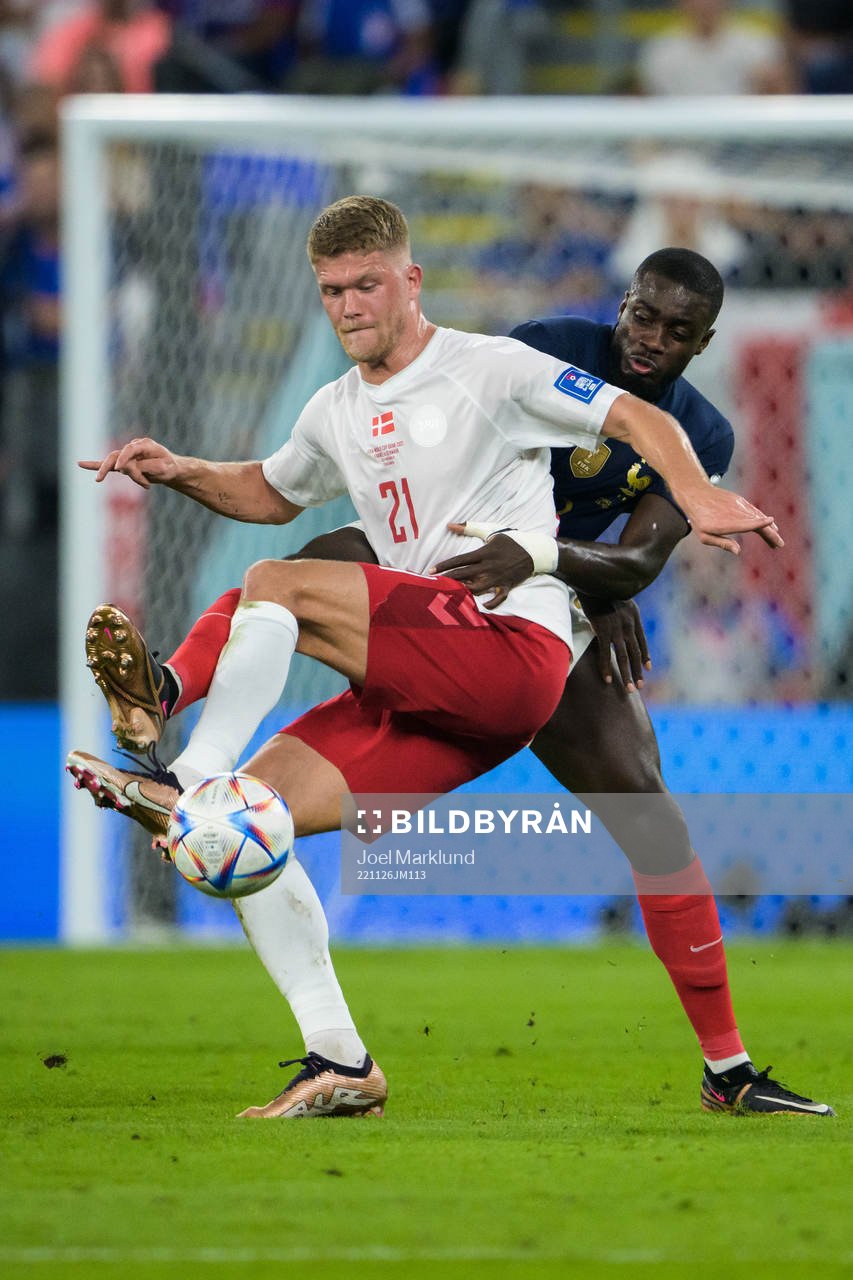 Andreas Cornelius of Denmark and Dayot Upamecano of France during the FIFA World Cup 2022 football match between France and Denmark on November 26, 2022 in Doha.