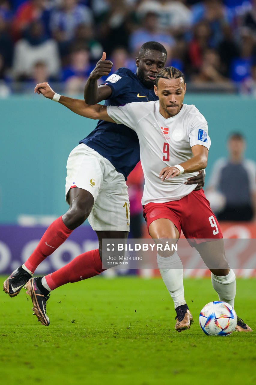 Dayot Upamecano of France and Martin Braithwaite of Denmark