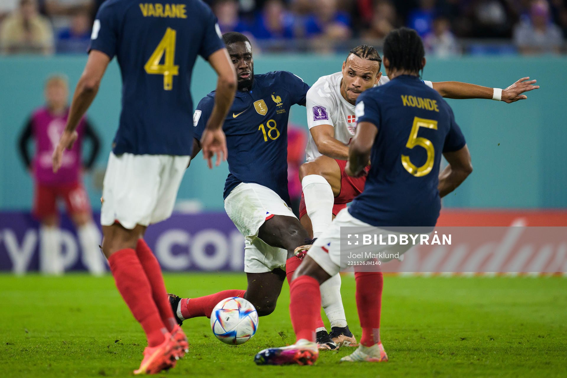 Dayot Upamecano of France tries to stop Martin Braithwaite