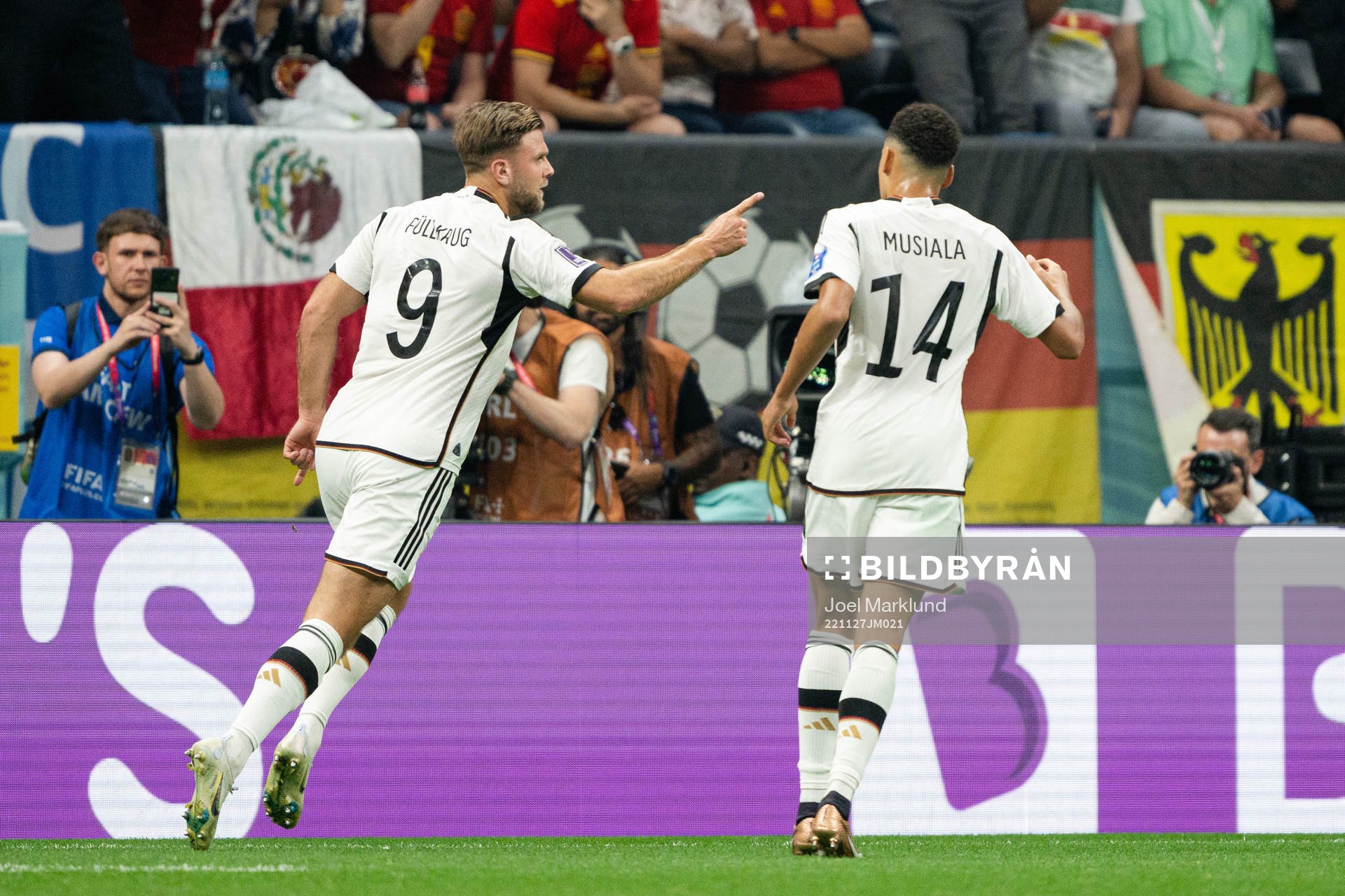 Niclas Füllkrug and Jamal Musiala of Germany celebrate the