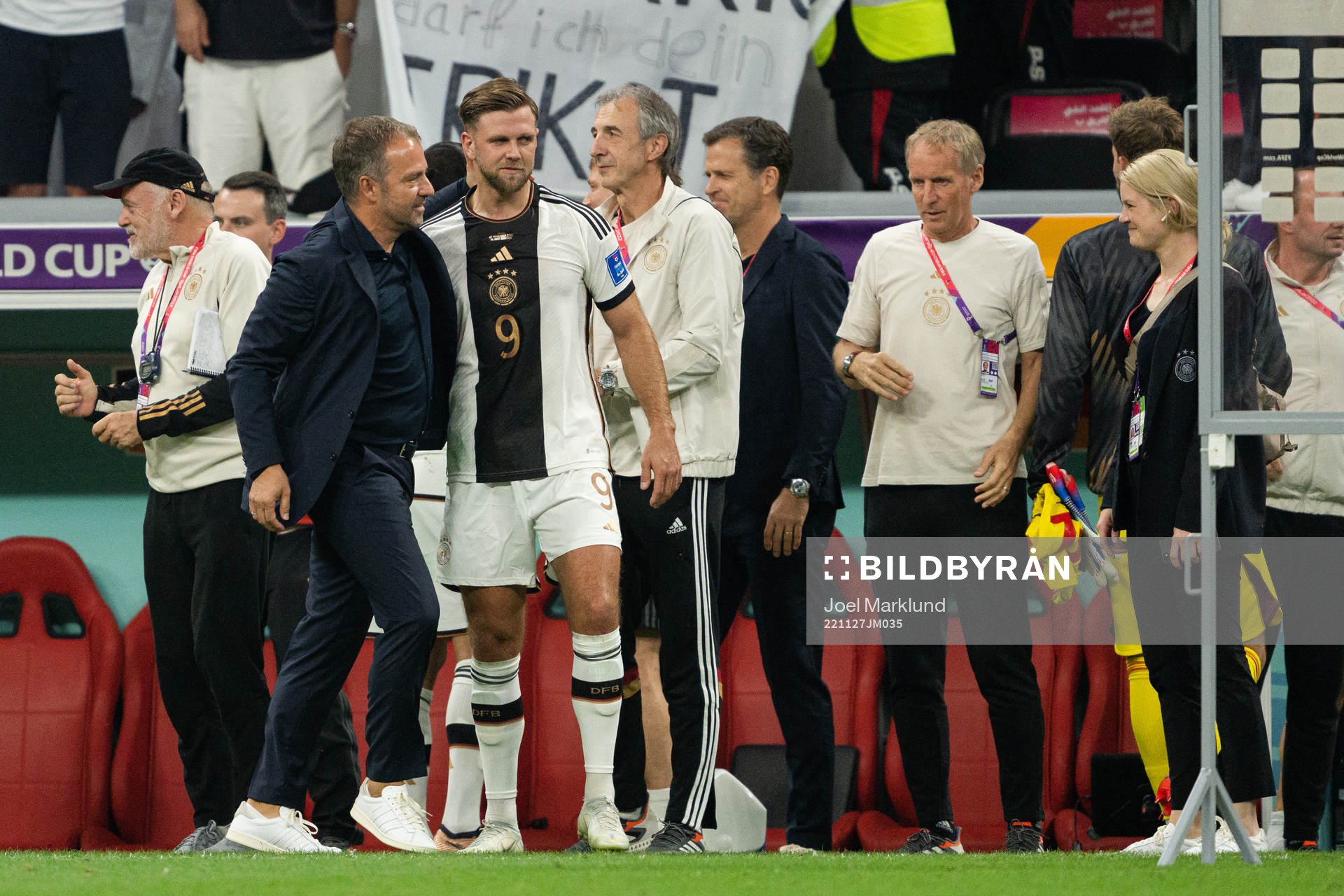 Niclas Füllkrug and head coach Hansi Flick of Germany