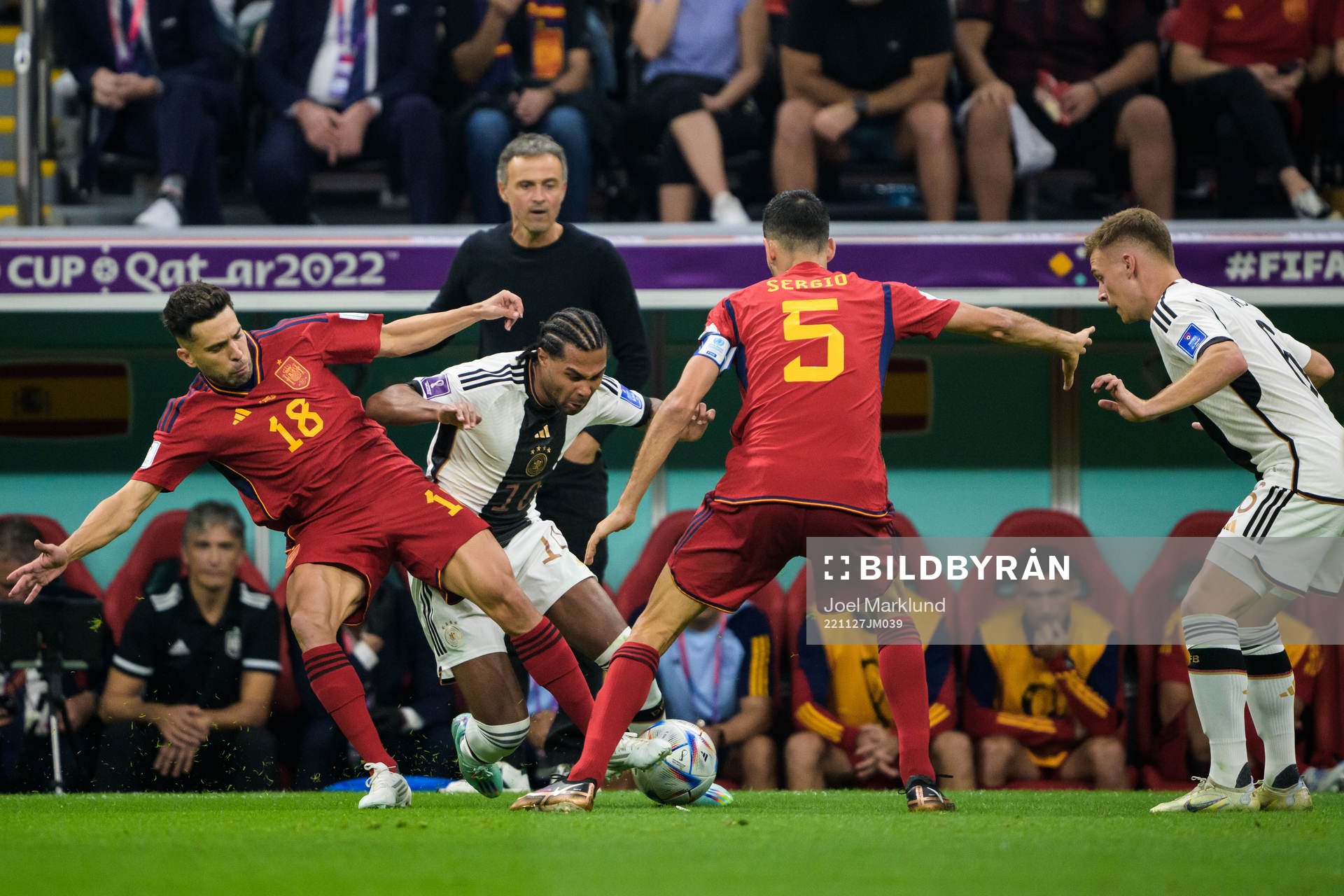 Jordi Alba and Sergio Busquets of Spain are being